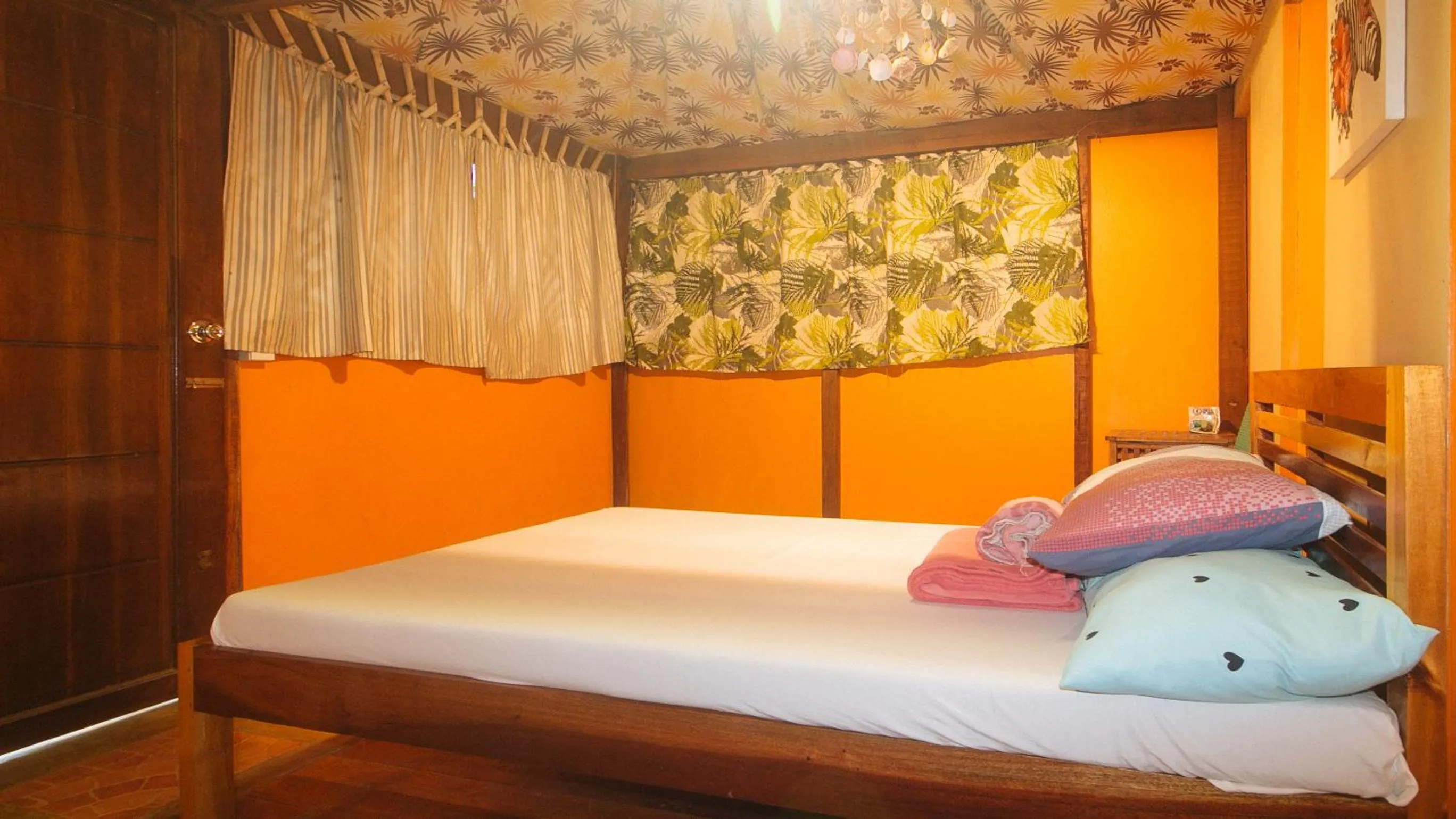 Bed in The Clara Beach and Guest House