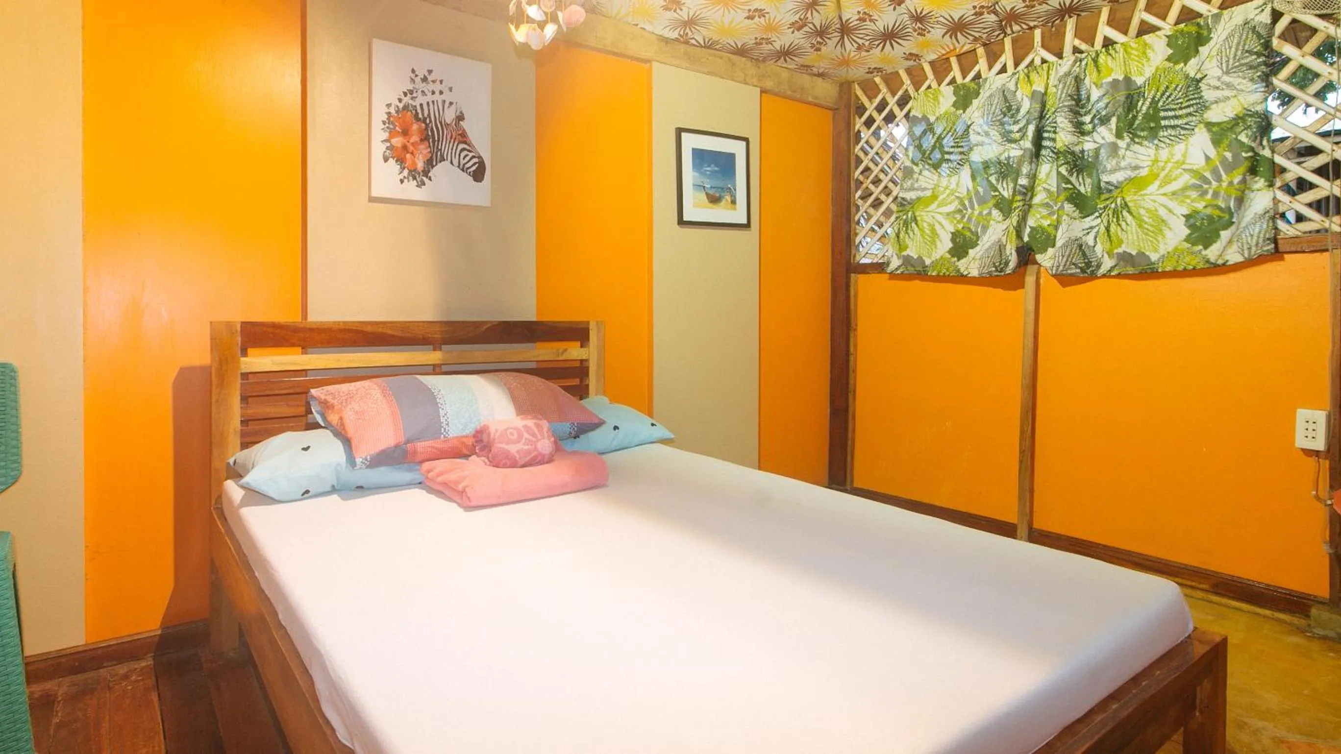 Bed in The Clara Beach and Guest House