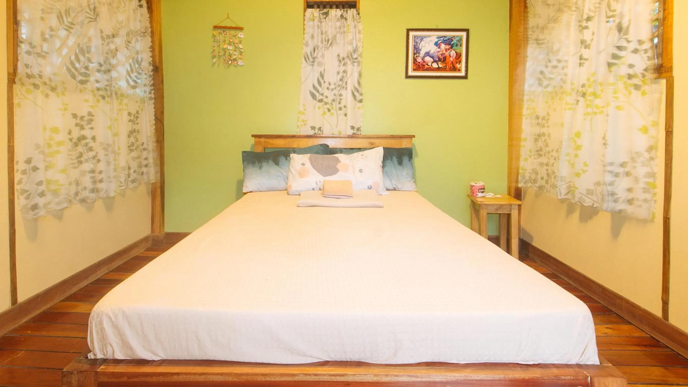 Bed in The Clara Beach and Guest House