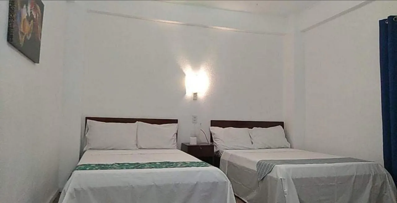 Bed in Sunvilla beachfront hotel