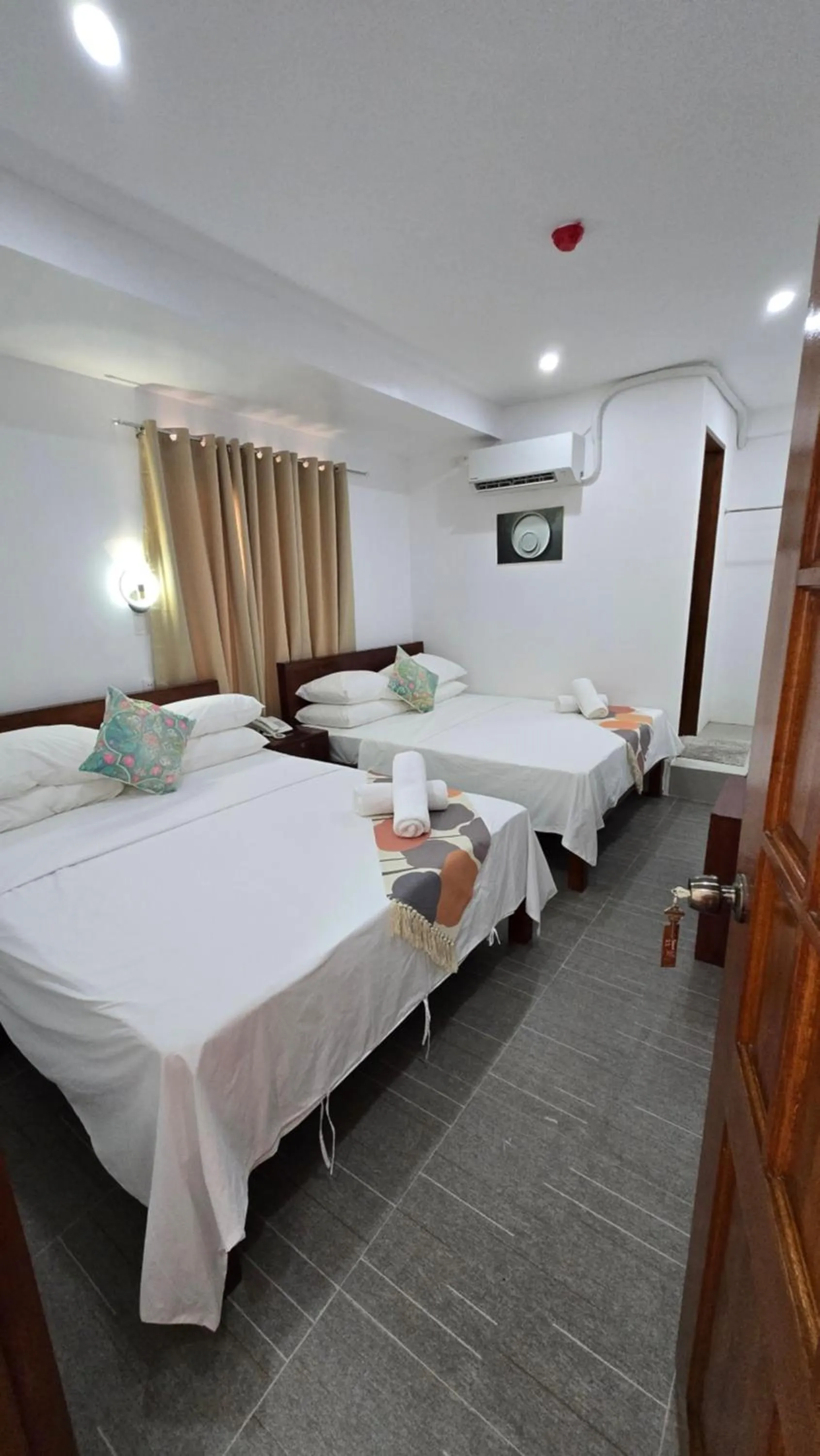 Bed in Sunvilla beachfront hotel
