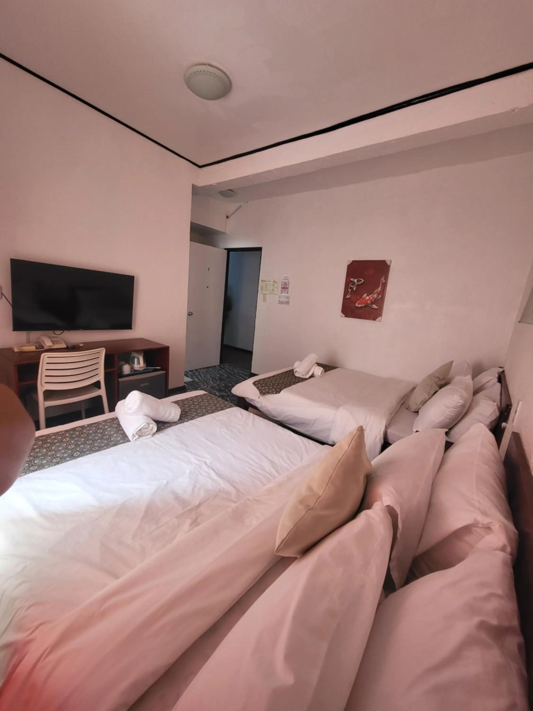 Bed in Sunvilla beachfront hotel