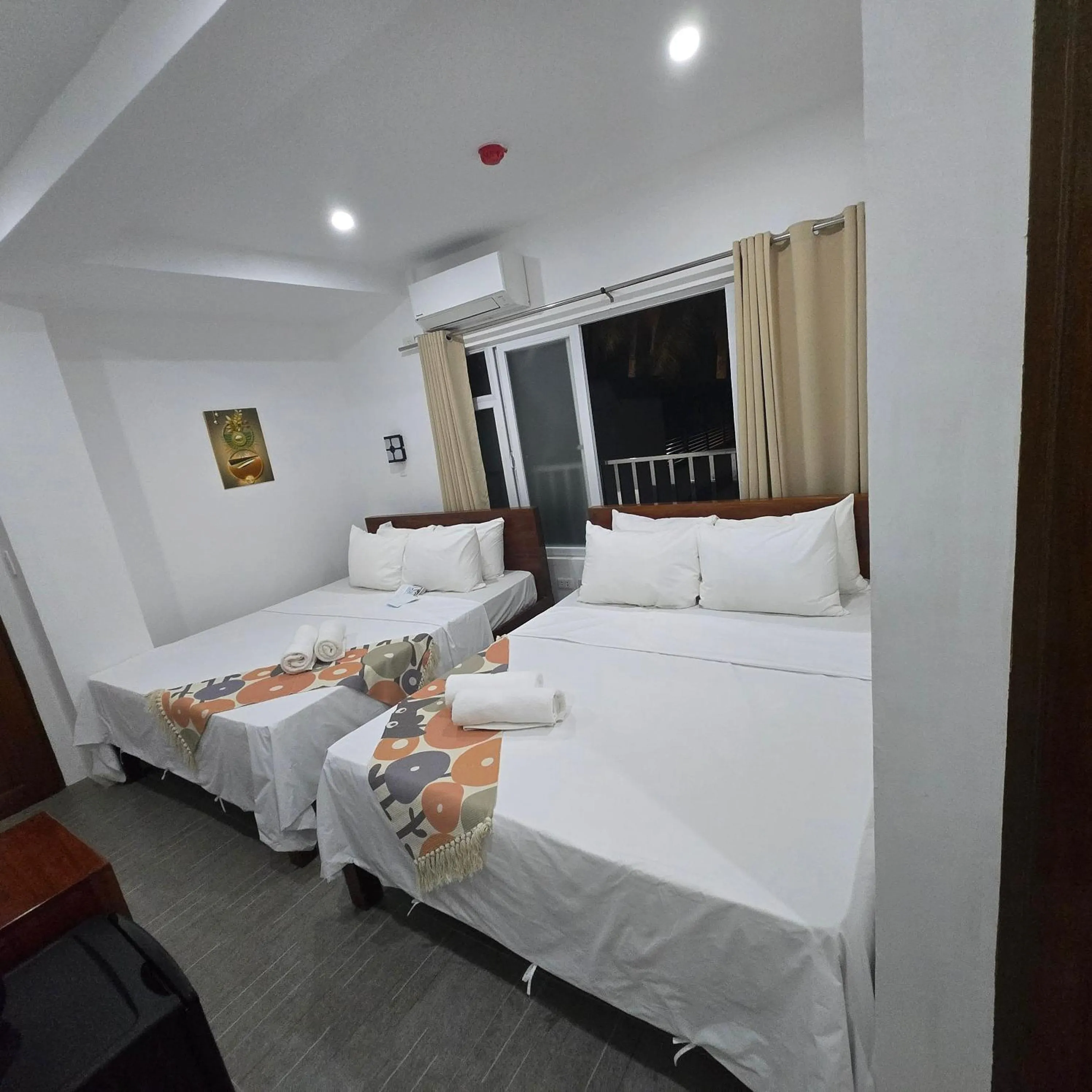 Bed in Sunvilla beachfront hotel