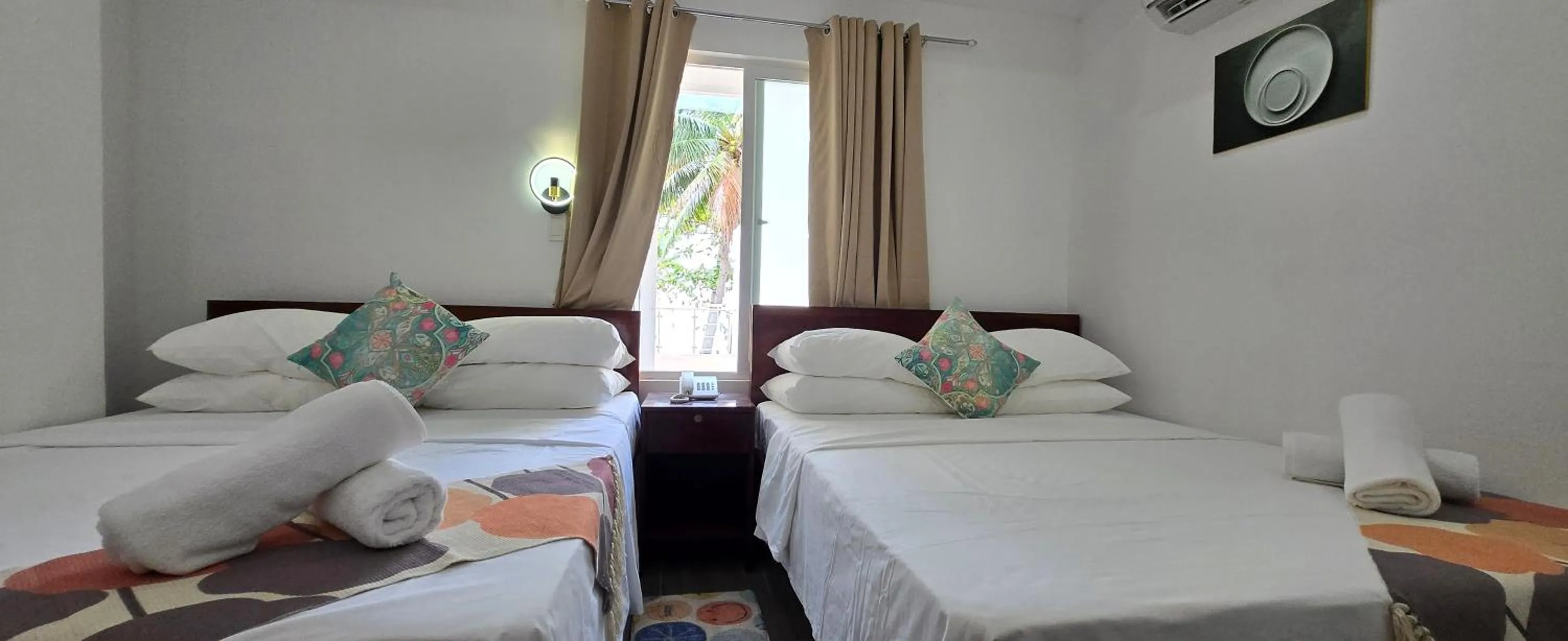 Bed in Sunvilla beachfront hotel