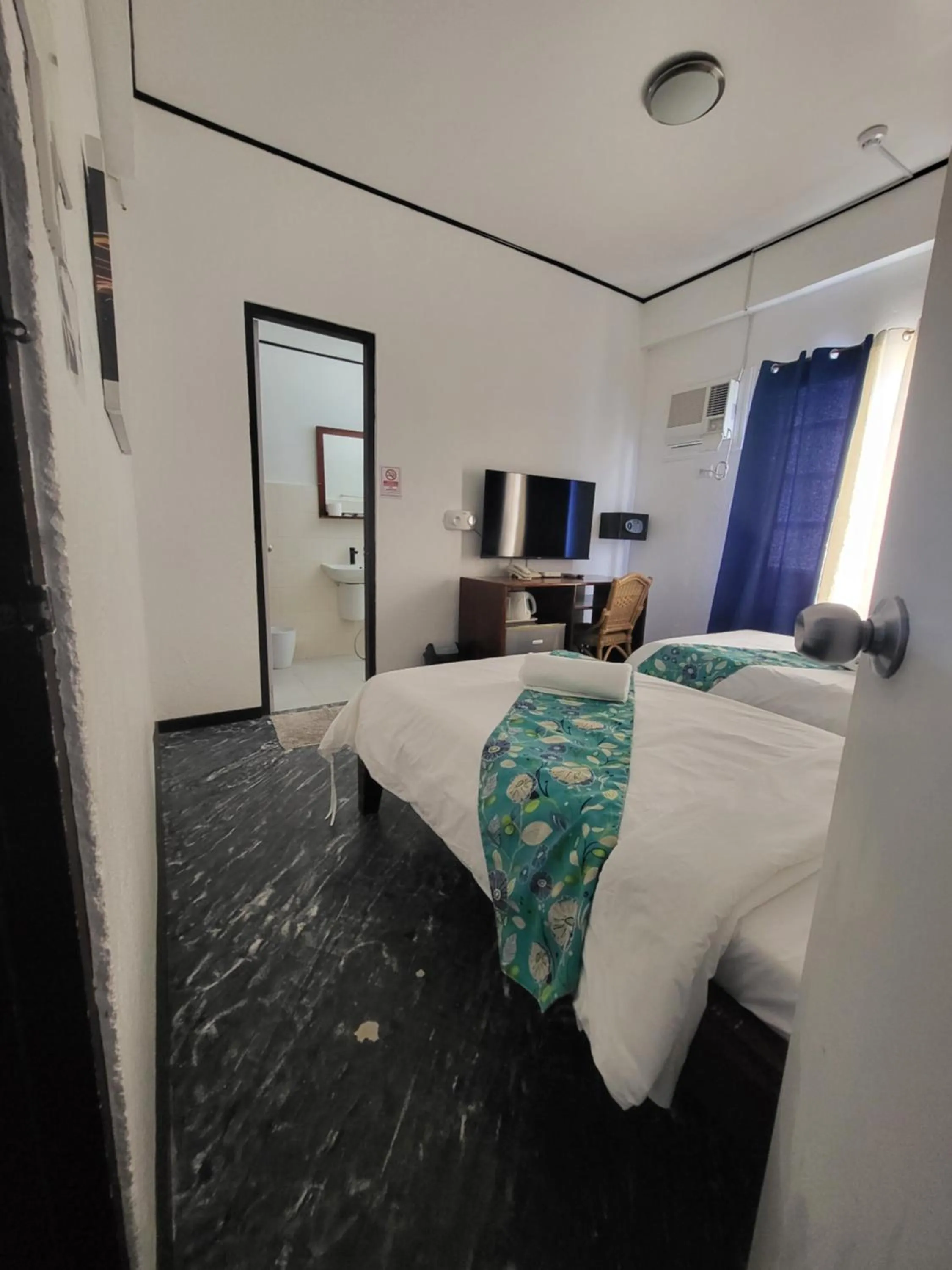 Bed in Sunvilla beachfront hotel