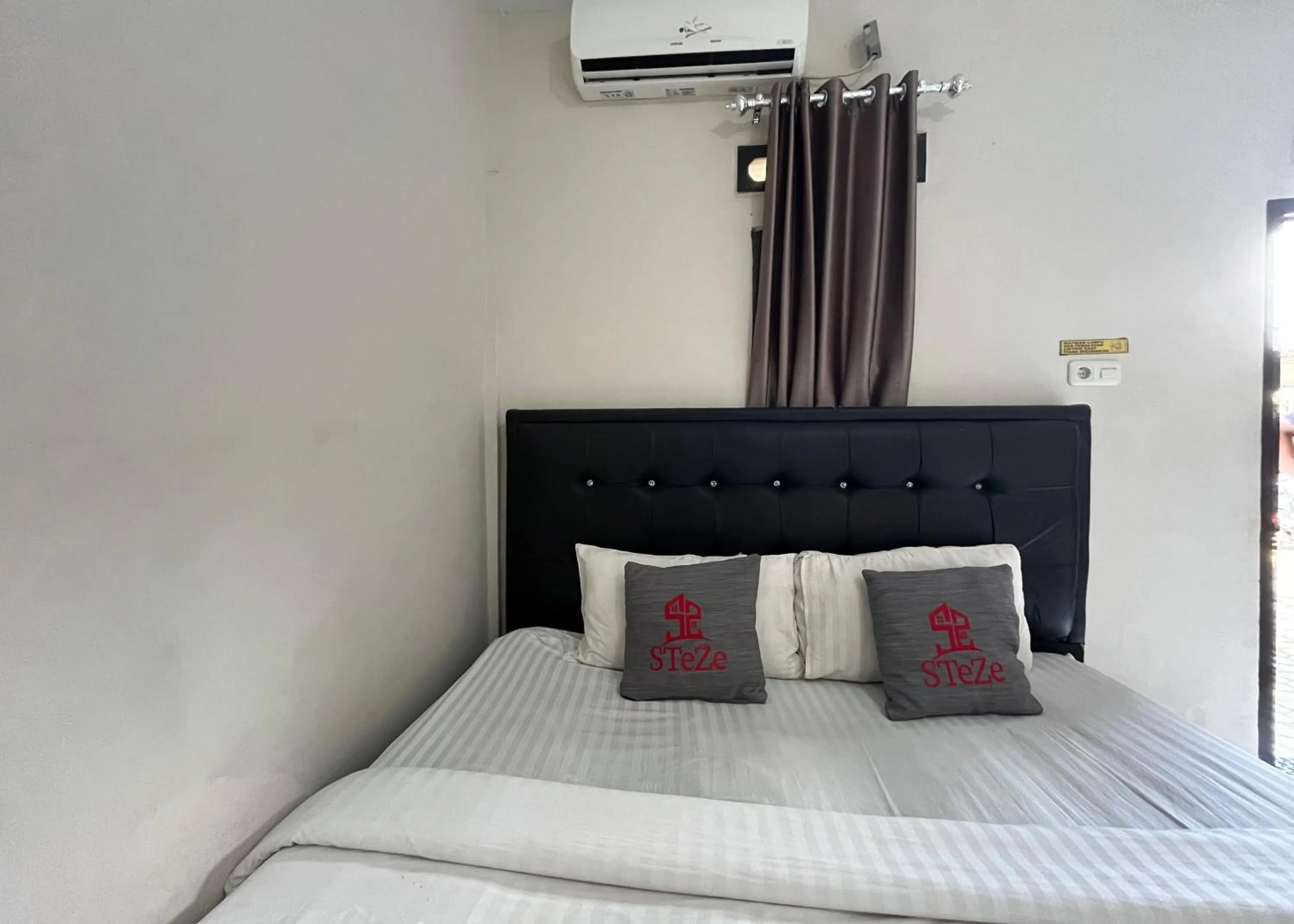 Bed in Steze Guesthouse Syariah Telanaipura
