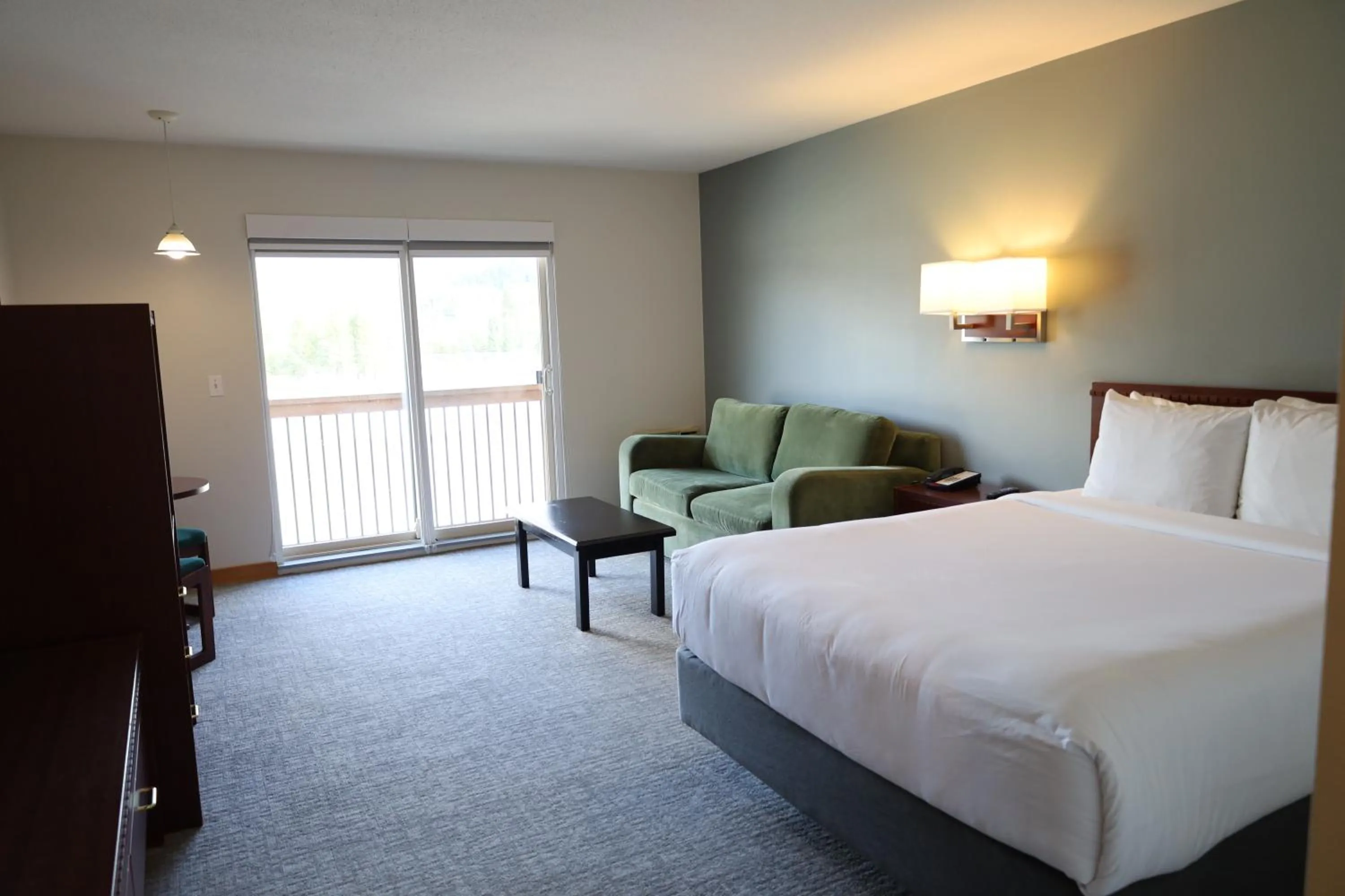 Bed in Glacier Mountain Lodge