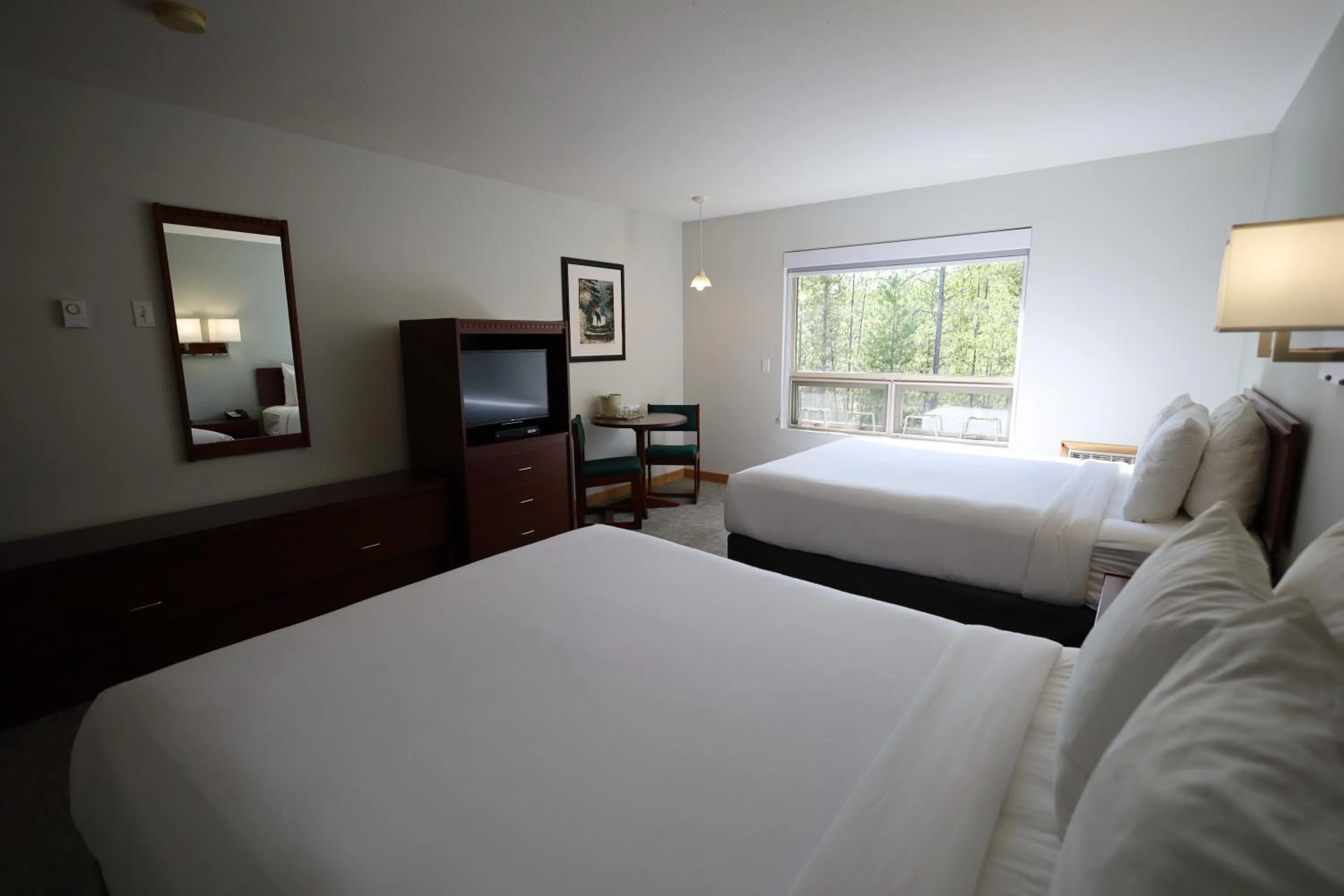 Bed in Glacier Mountain Lodge