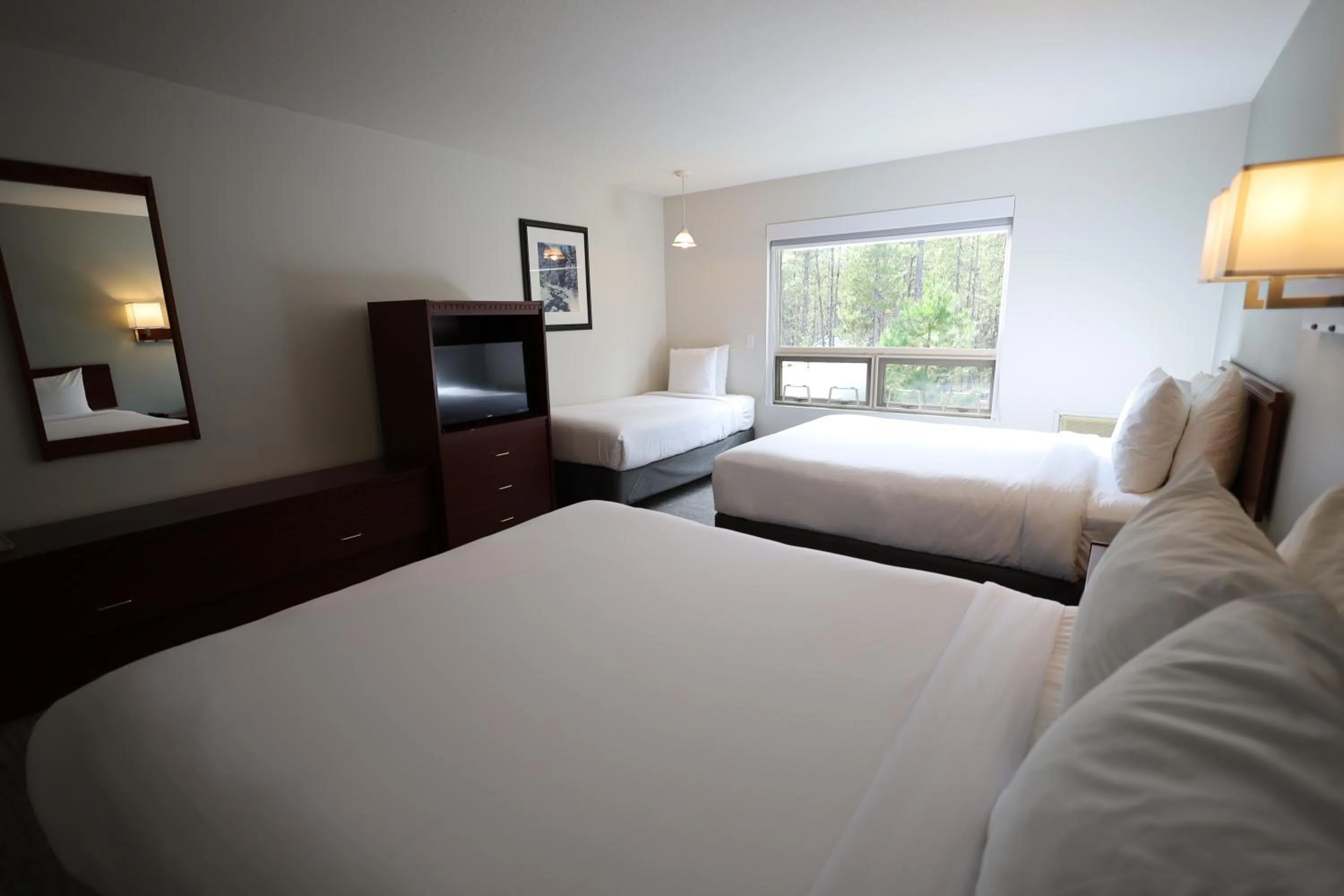 Bed in Glacier Mountain Lodge