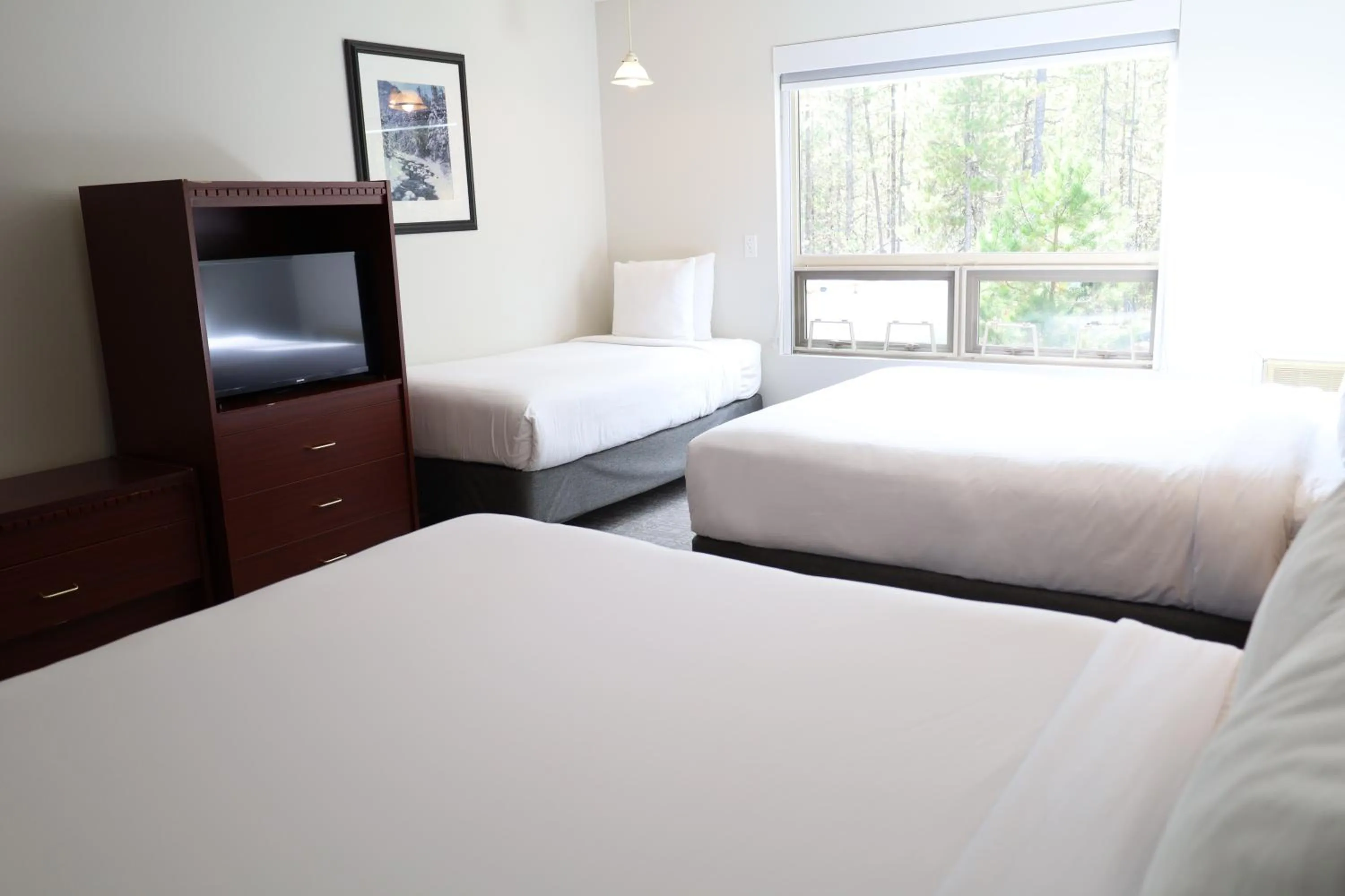 Bed in Glacier Mountain Lodge