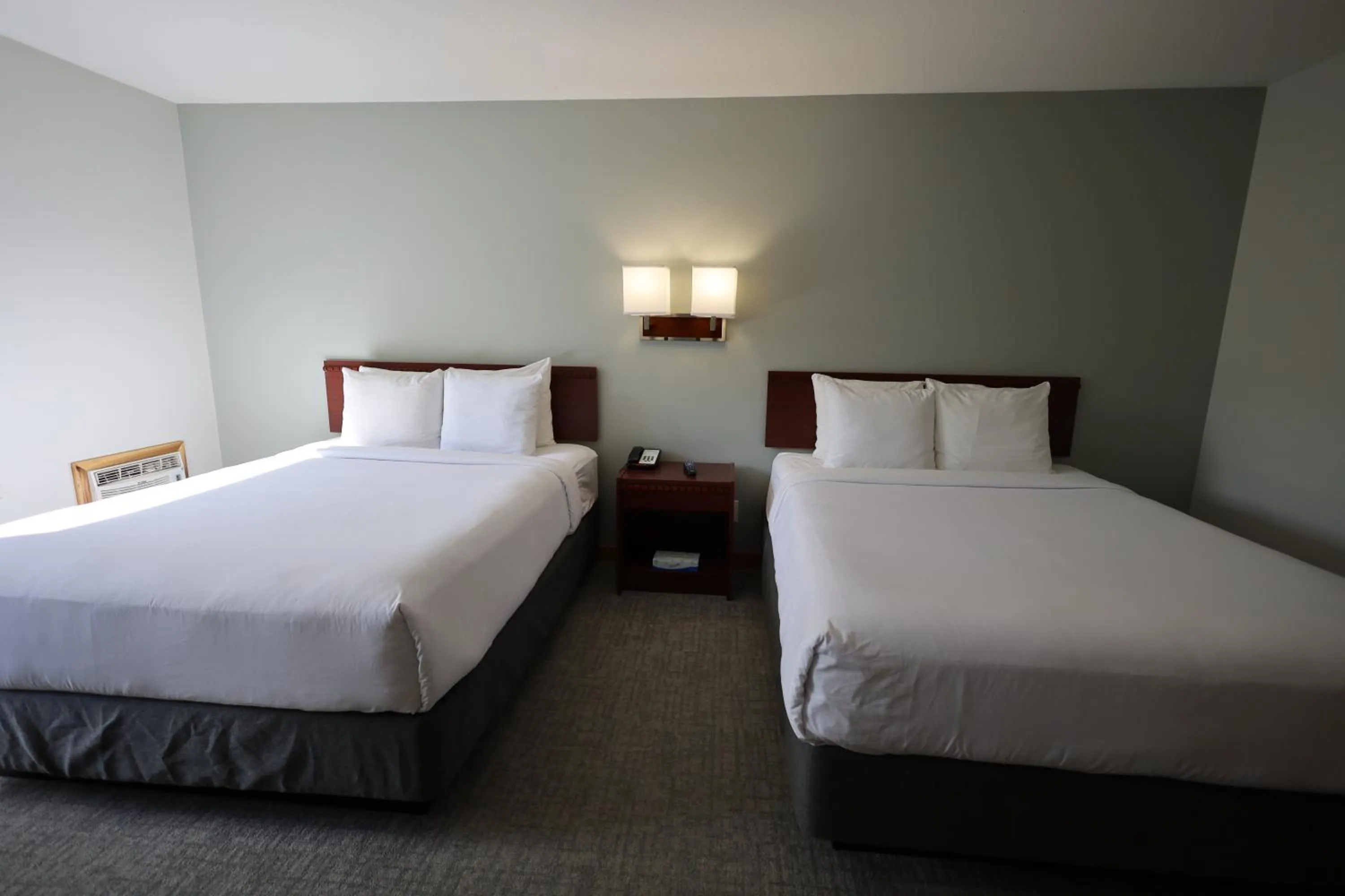 Bed in Glacier Mountain Lodge