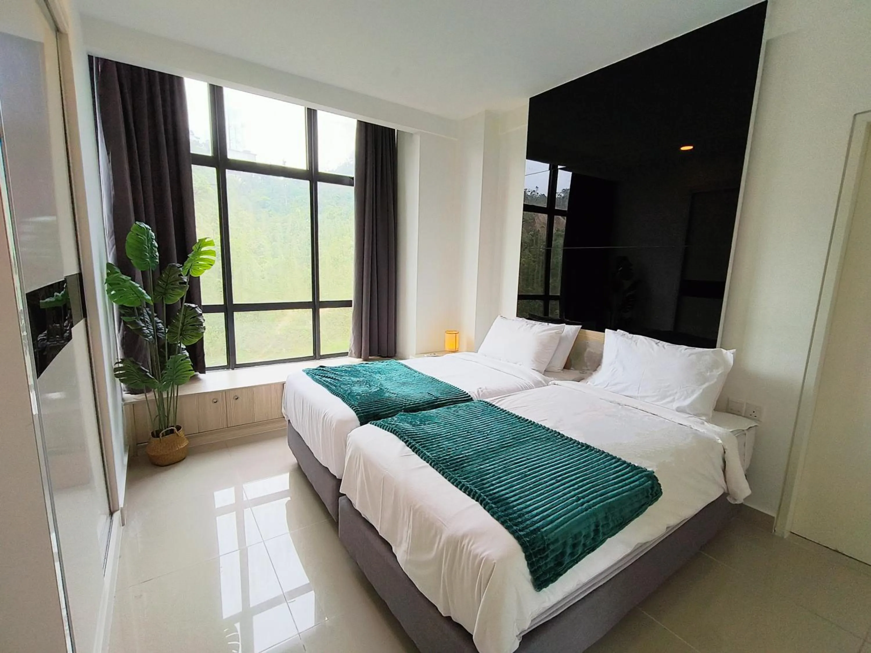 Photo of the whole room, Bed in Emerald Homes Cozy Homestay at Ion Delemen Genting Highlands