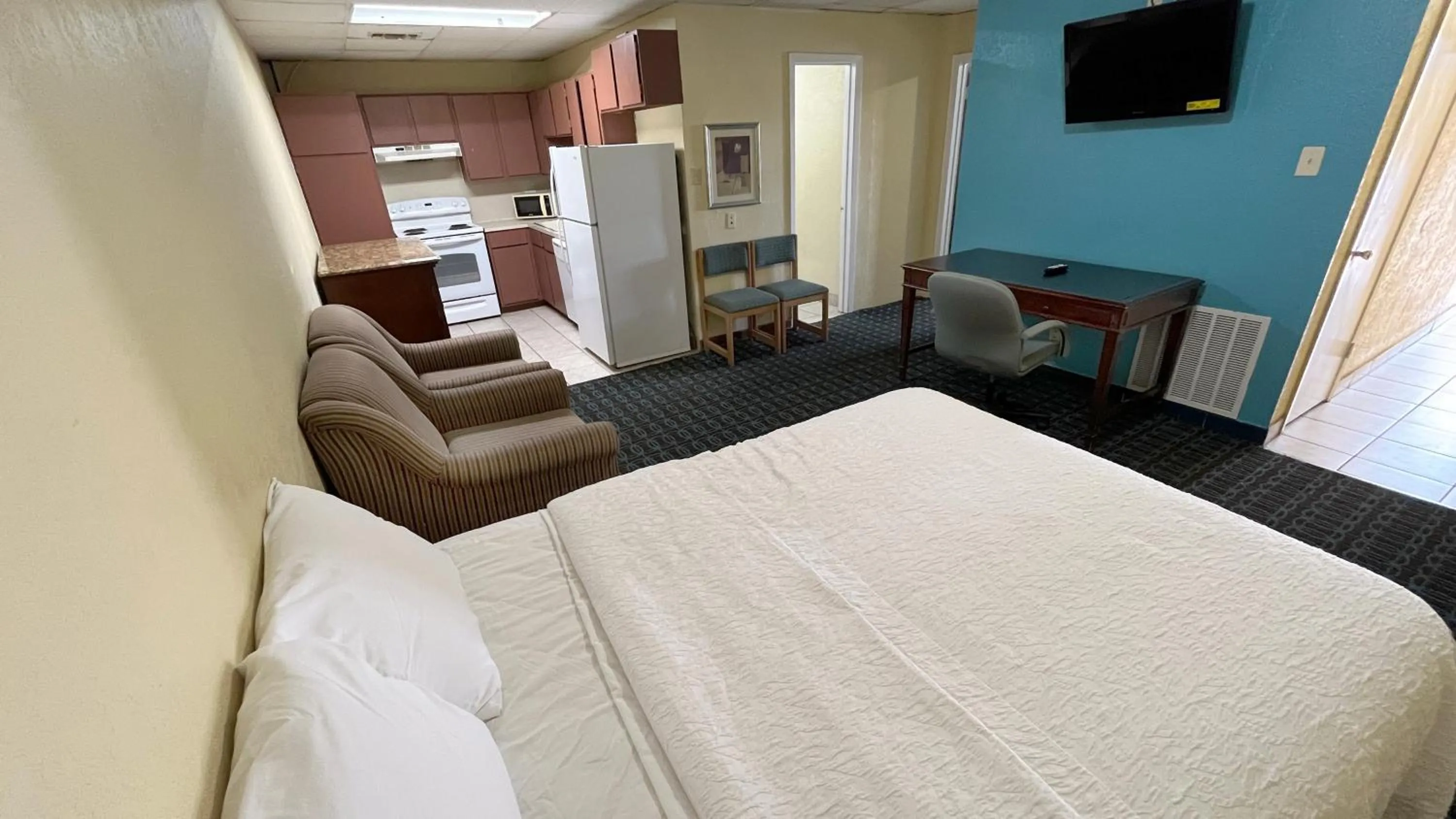 Bed in Extended Stay Motel - Snyder