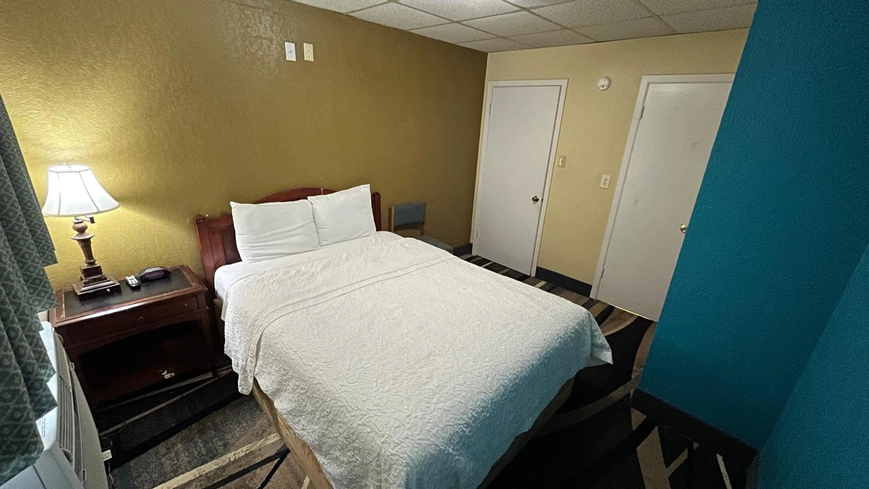 Bed in Extended Stay Motel - Snyder