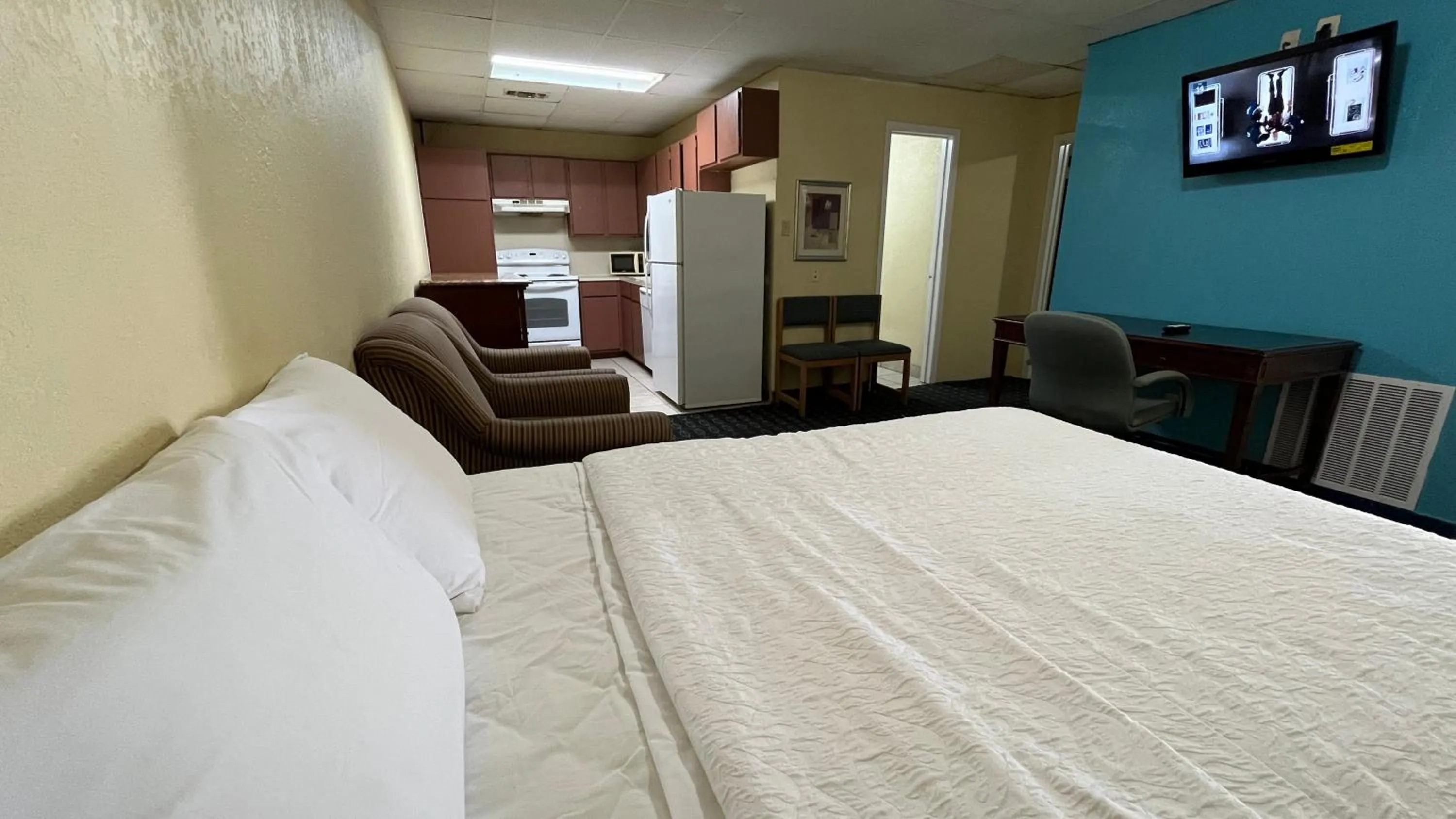 Bed in Extended Stay Motel - Snyder