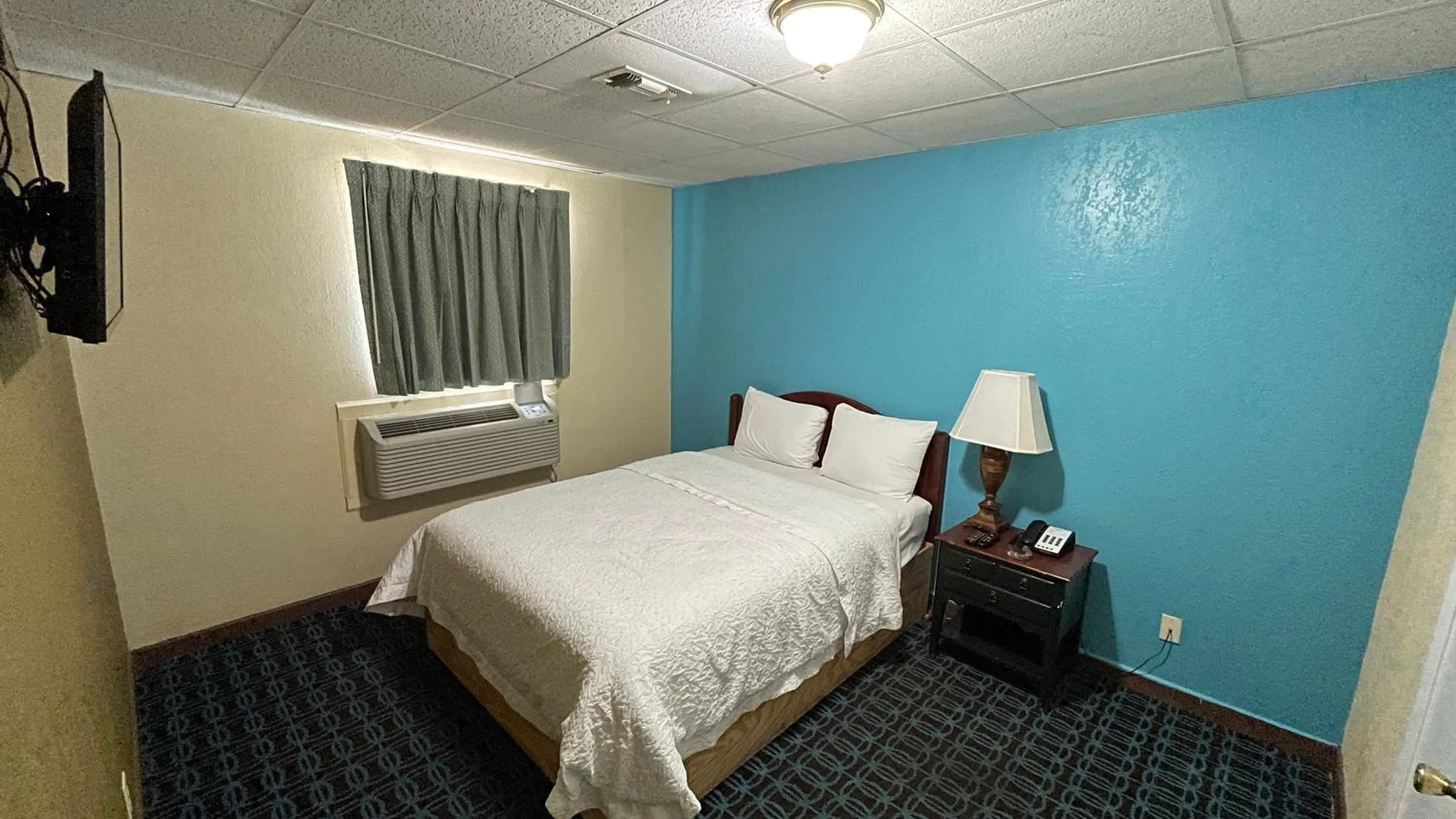 Bed in Extended Stay Motel - Snyder