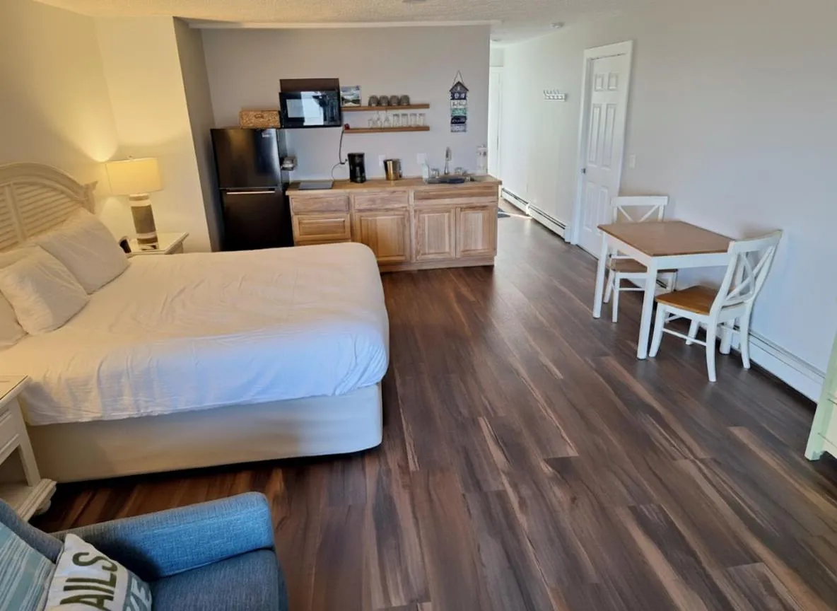 Bed in Pointes North Beachfront Hotel - 2 Person Spa Tub Studios