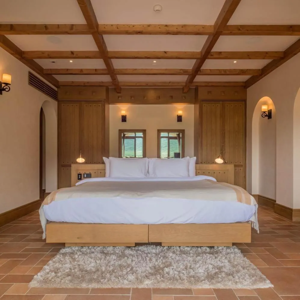 Bed in Toscana Town Square Suites