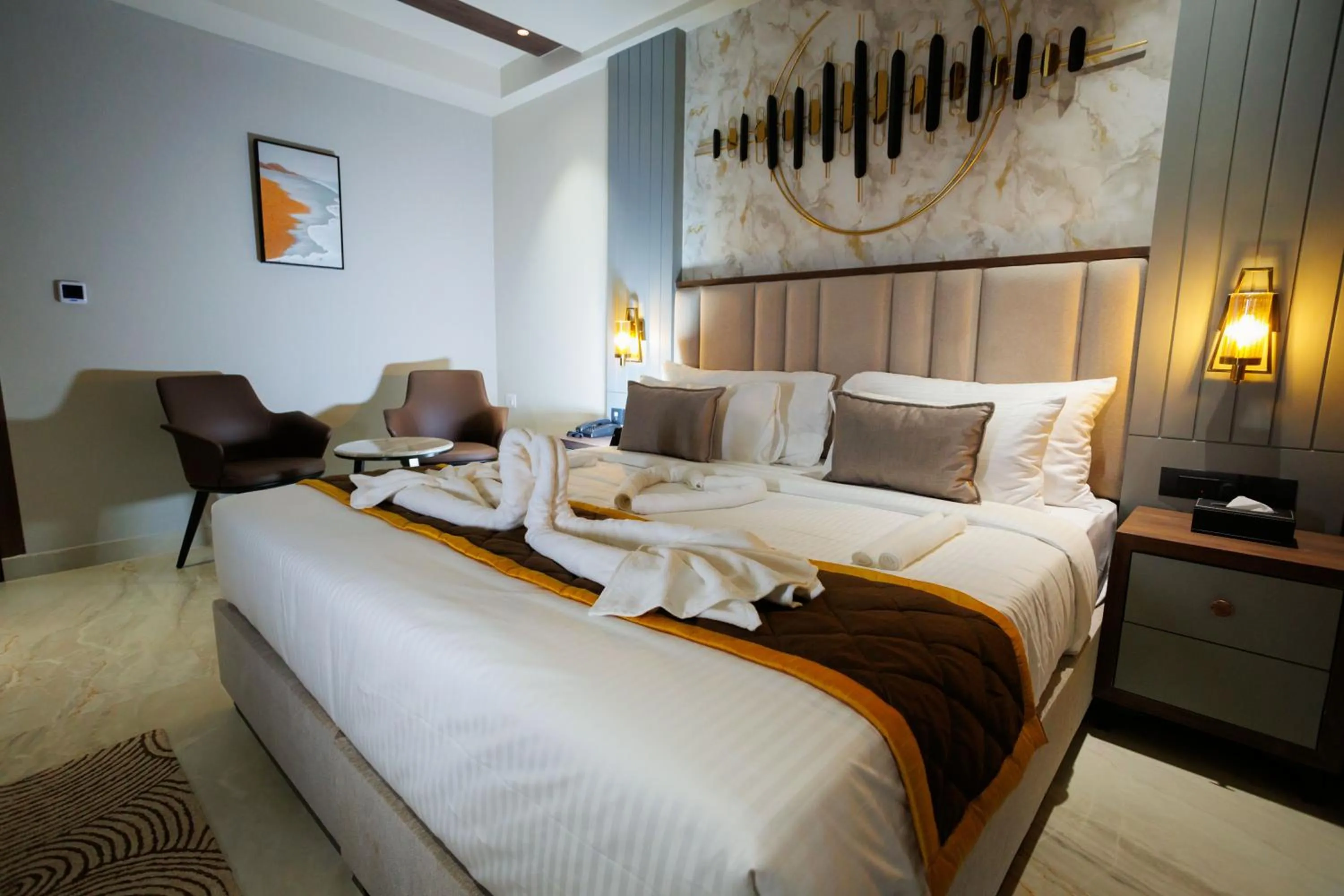 Bed in AJ GRAND ELITE HOTEL