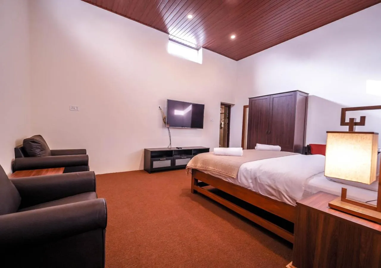 Bed in Lauriston Ooty Town Heritage Bungalow by VOYE HOMES