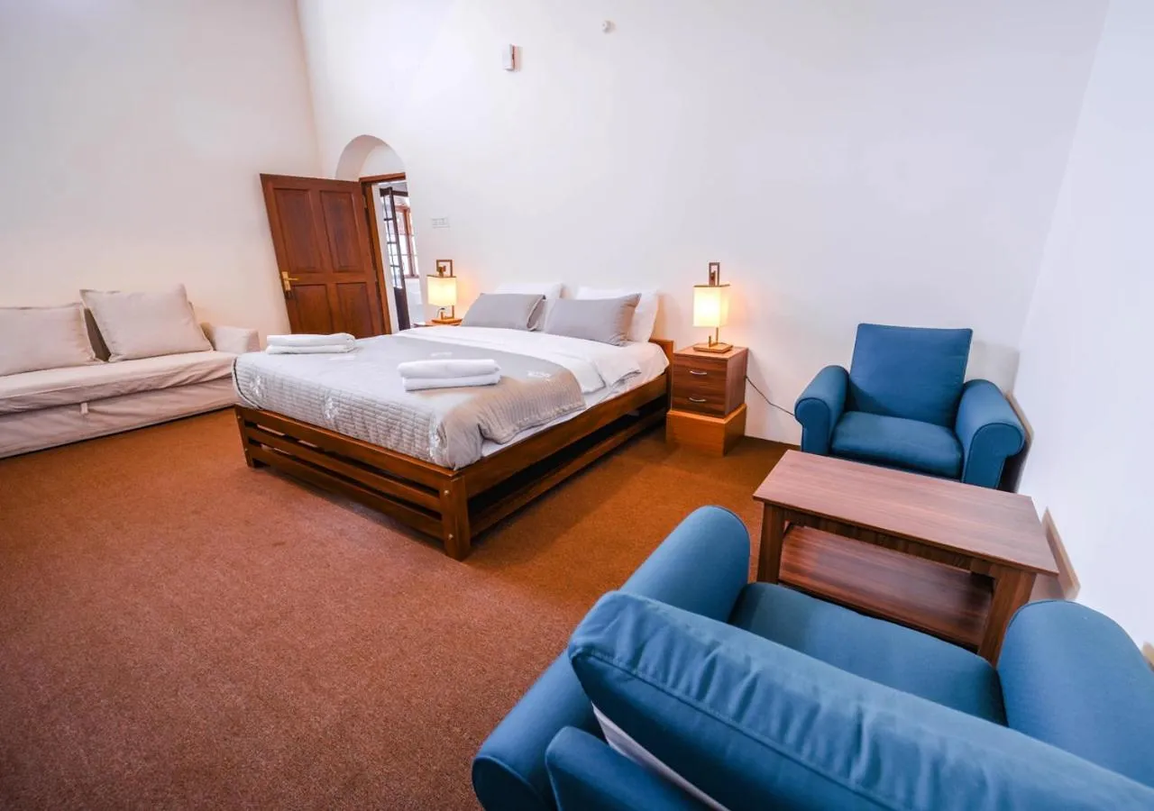 Bed in Lauriston Ooty Town Heritage Bungalow by VOYE HOMES