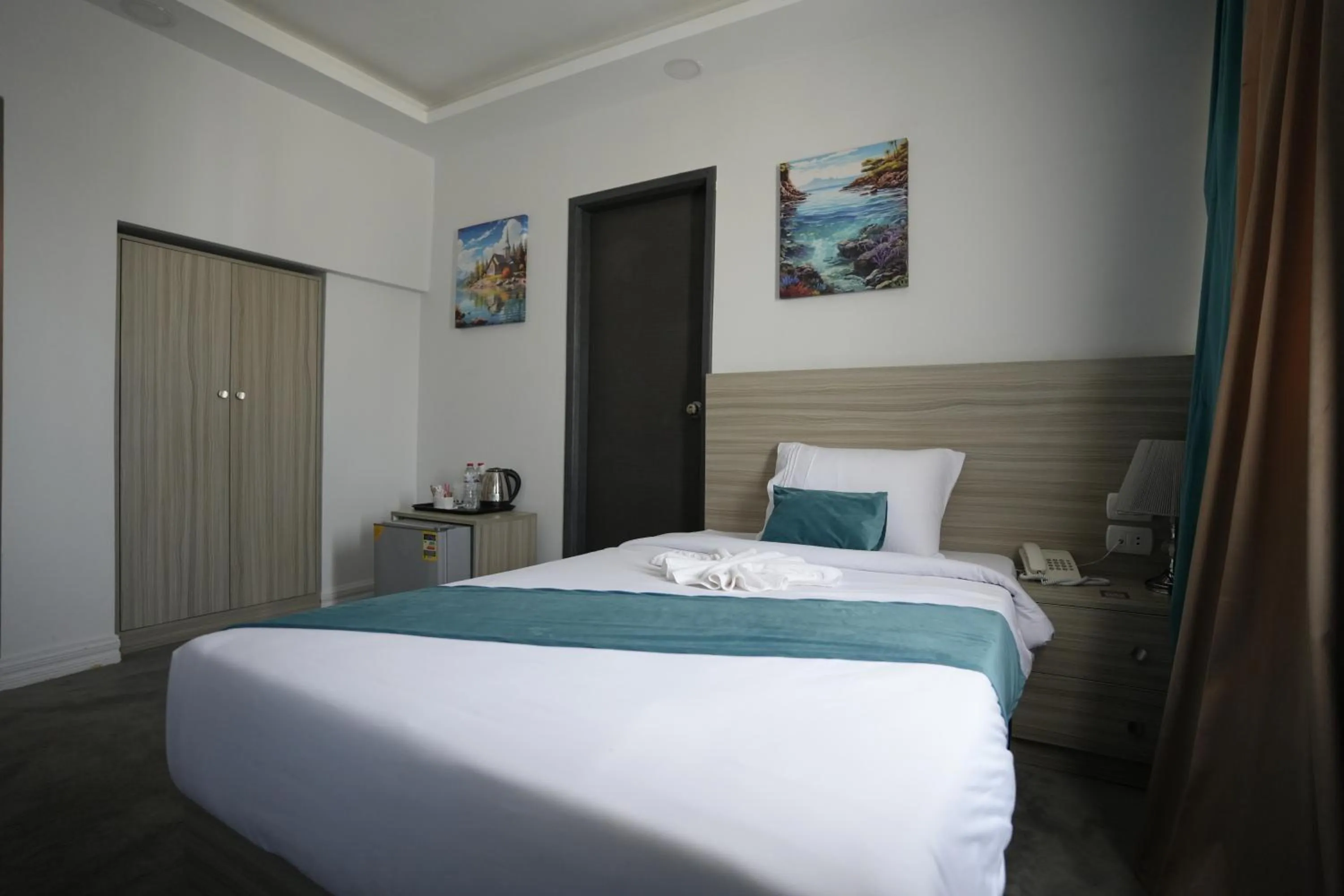 Bed in Mar Charbel Hotel Cairo