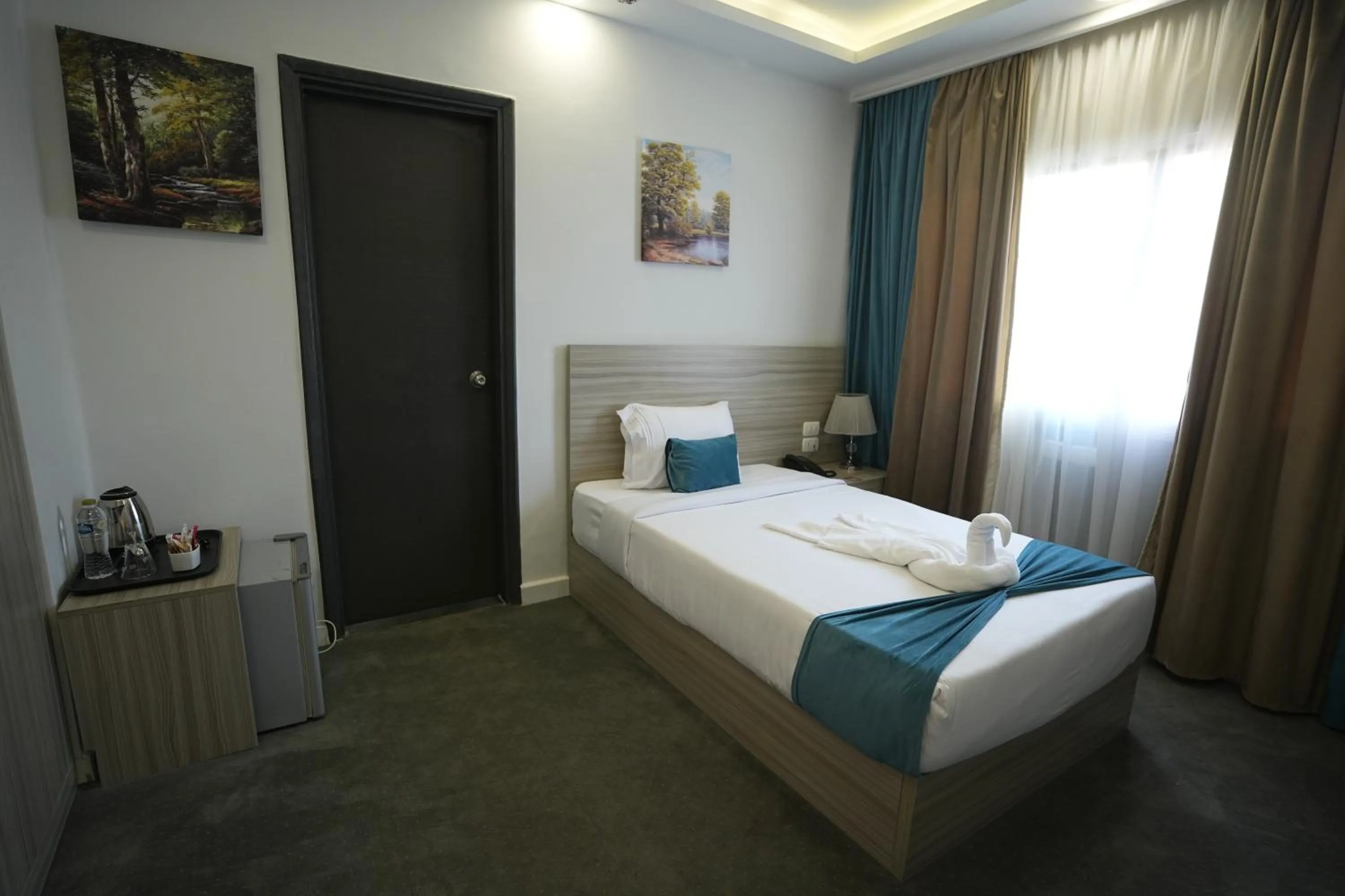 Bed in Mar Charbel Hotel Cairo