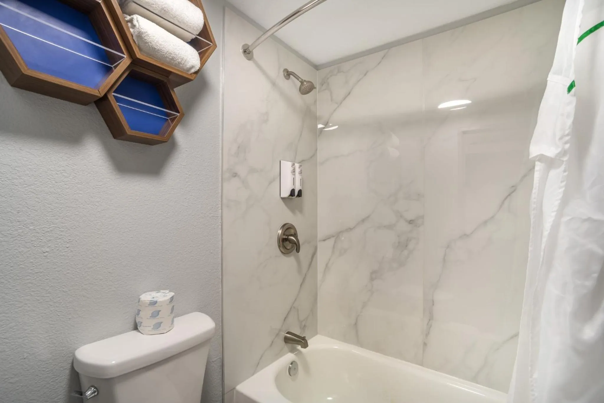 Bathroom in HomeTowne Studios by Red Roof Greenville