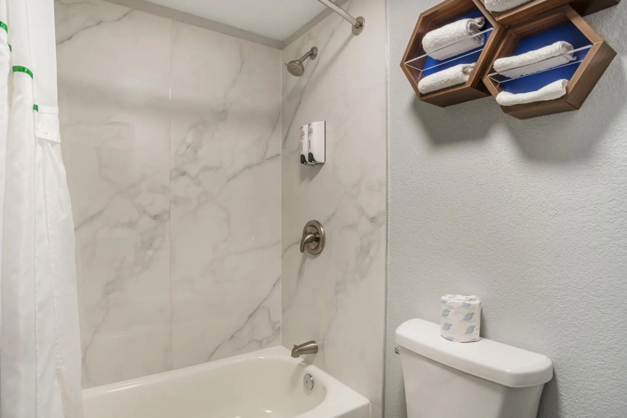 Bathroom in HomeTowne Studios by Red Roof Greenville