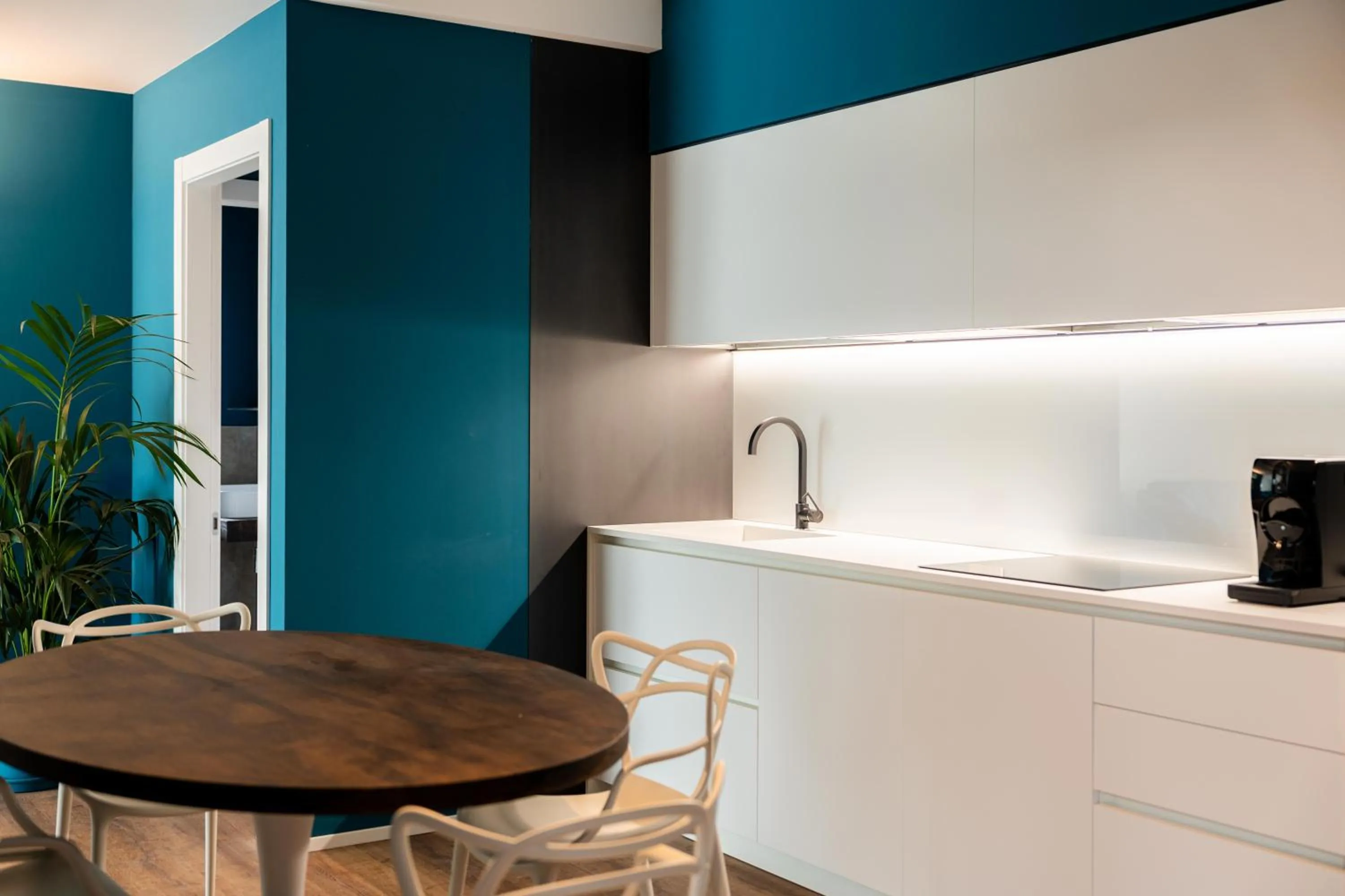 Kitchen or kitchenette in Camoma Aparthotel - Suites Apartments