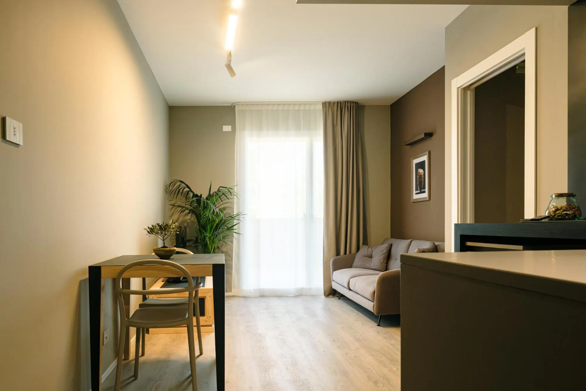 Living room, Bed in Camoma Aparthotel - Suites Apartments