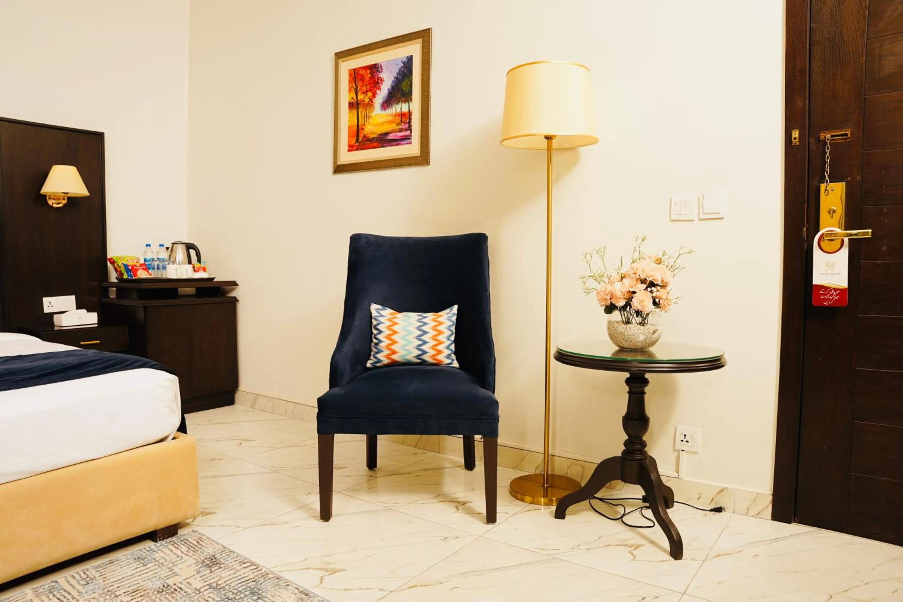 Seating area, Bed in Faletti’s Grand MM Alam Road