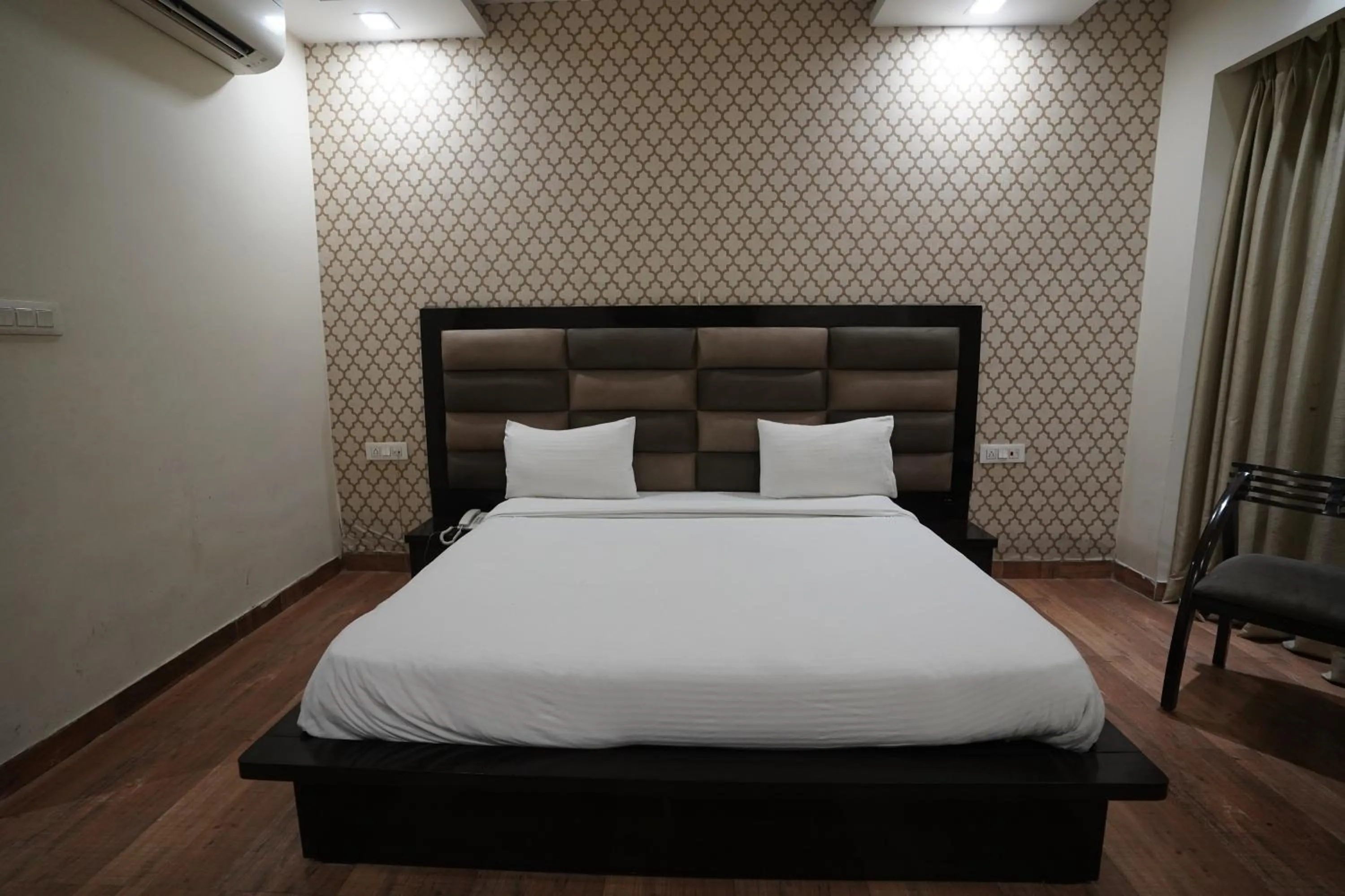 Bed in Nirmal Hotel And Resort