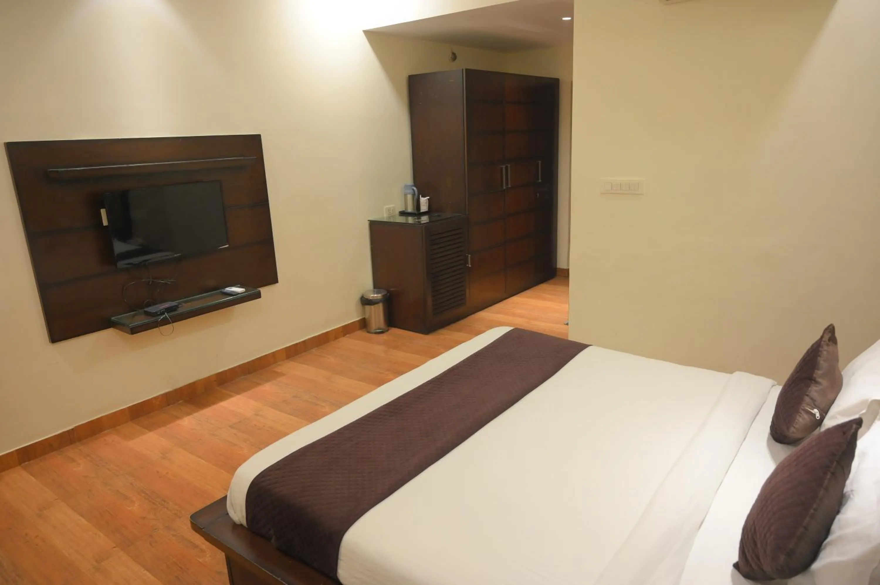 Bed in Nirmal Hotel And Resort