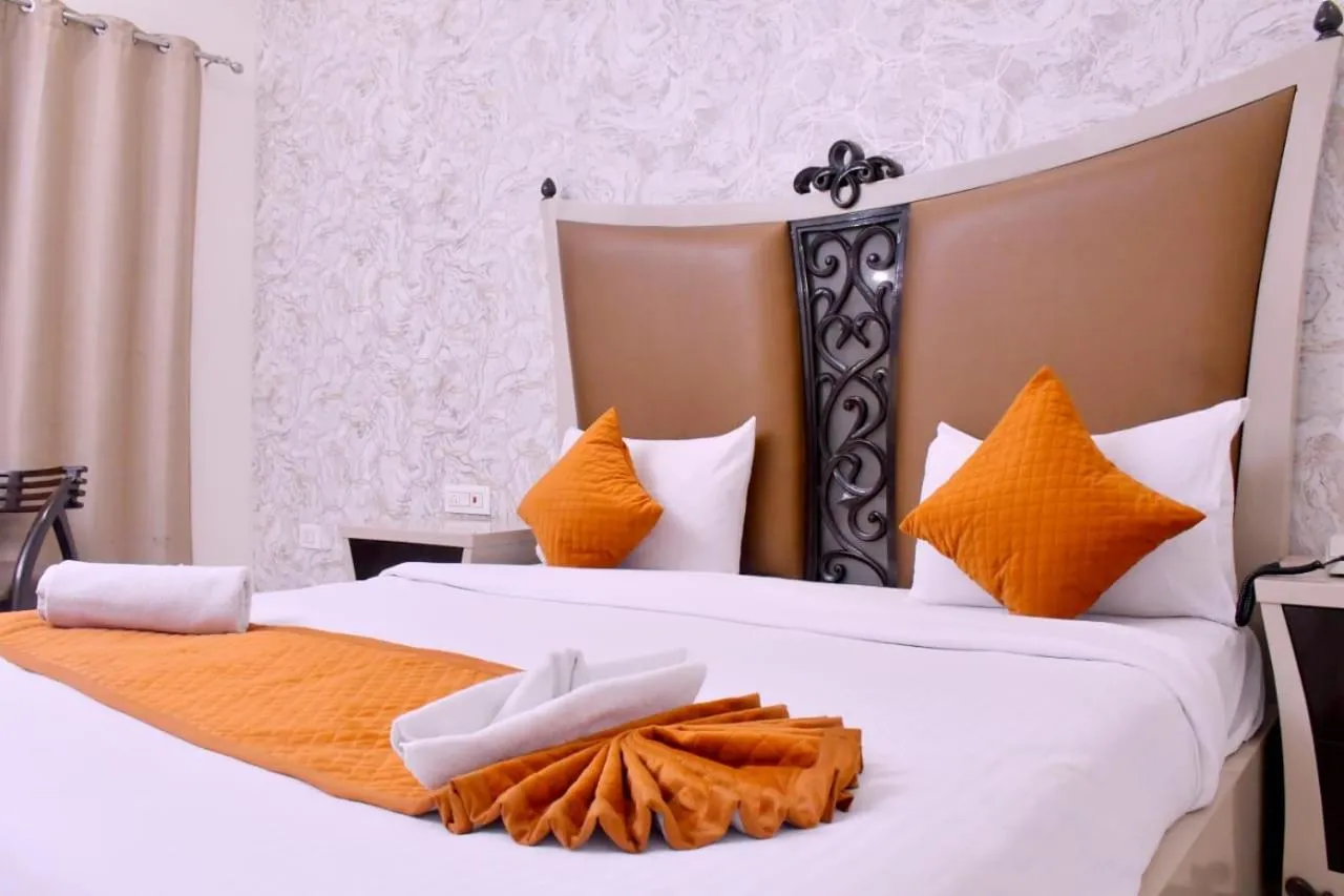 Bed in Nirmal Hotel And Resort