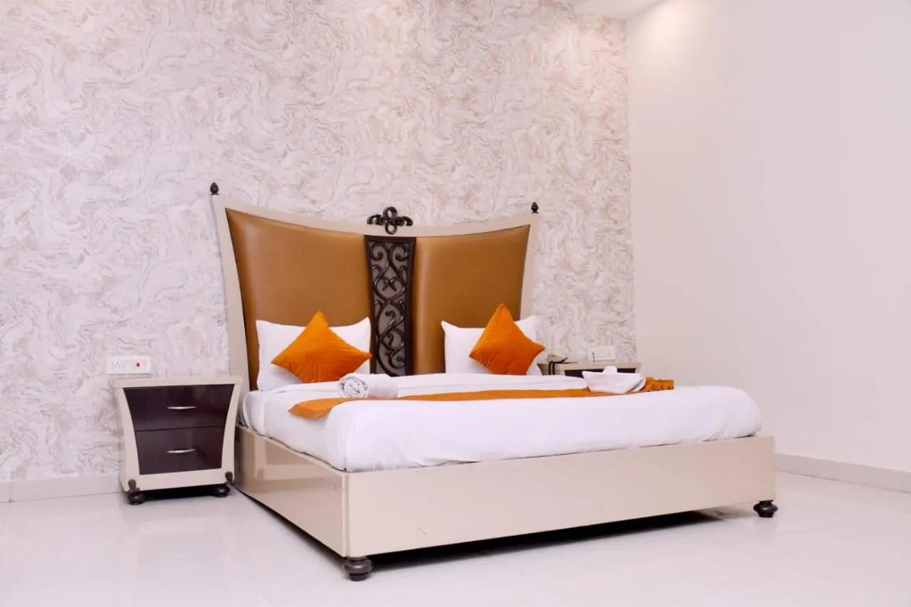 Bed in Nirmal Hotel And Resort