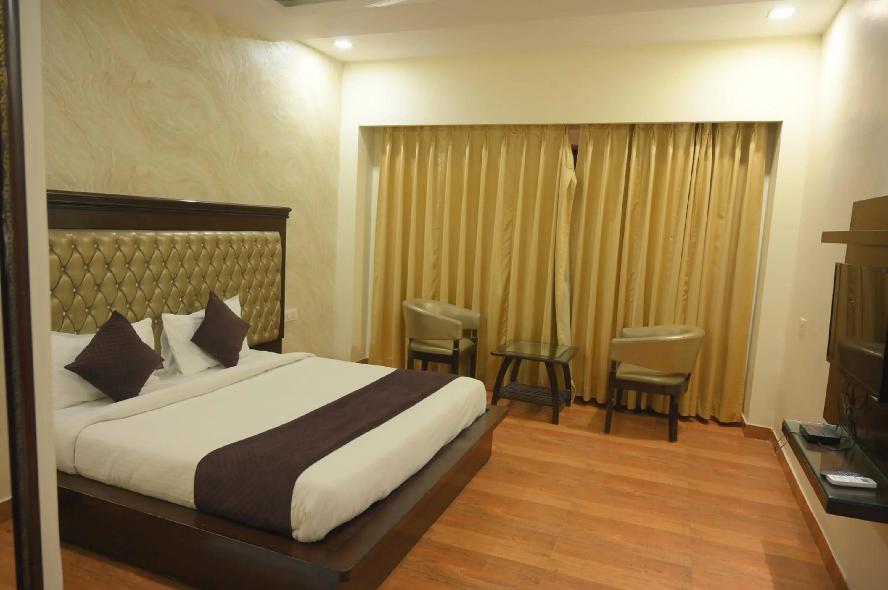 Bed in Nirmal Hotel And Resort