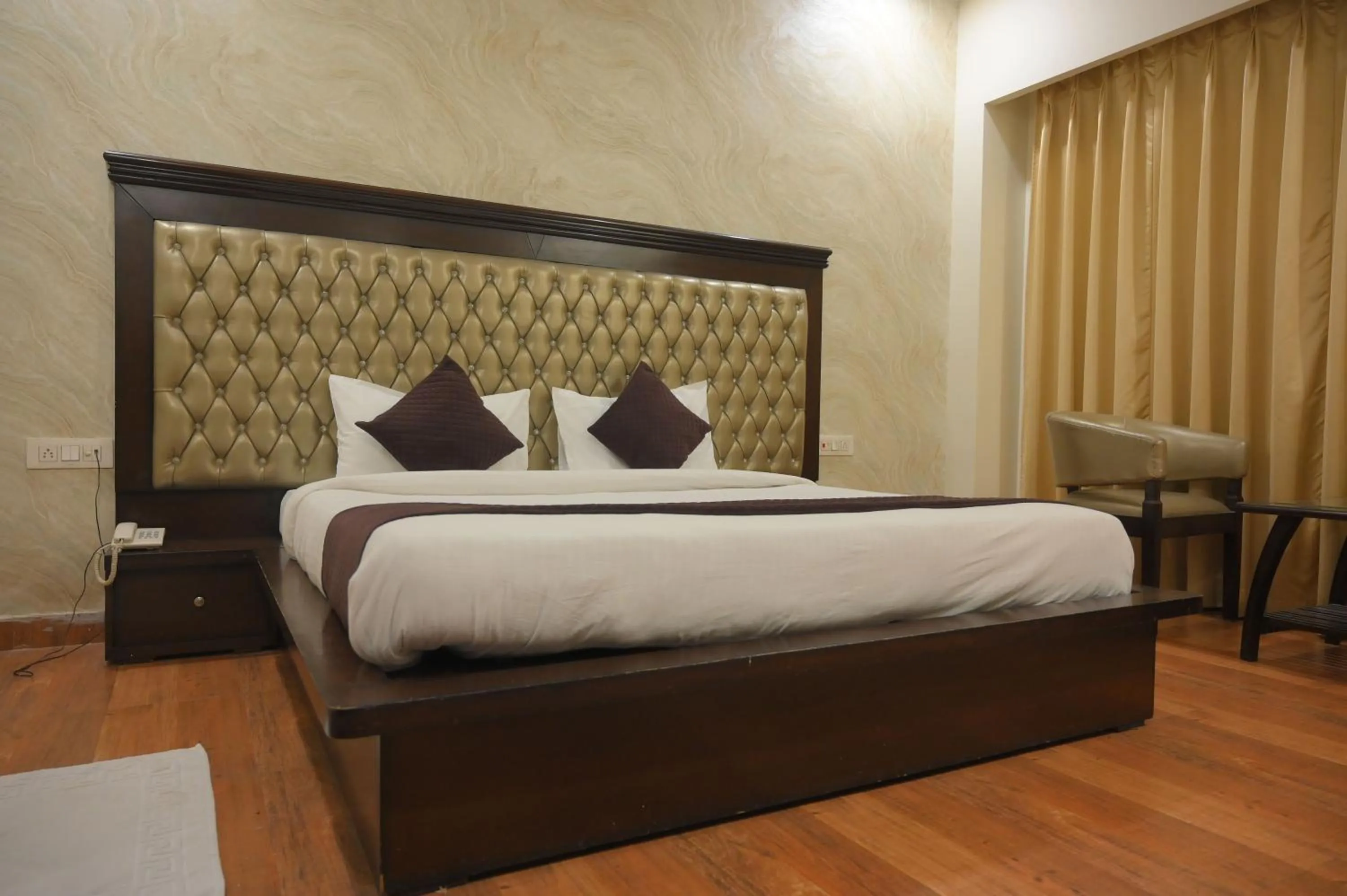Bed in Nirmal Hotel And Resort