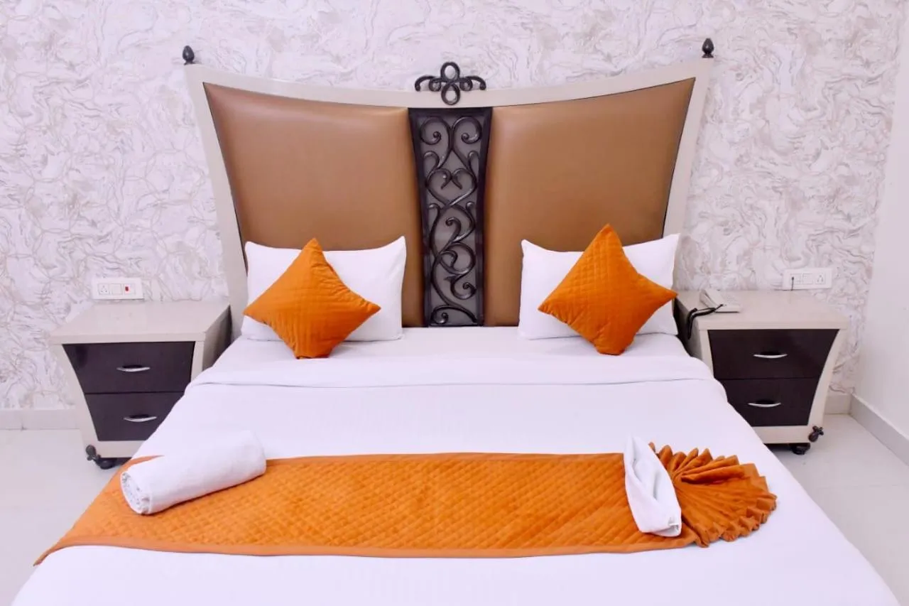Bed in Nirmal Hotel And Resort