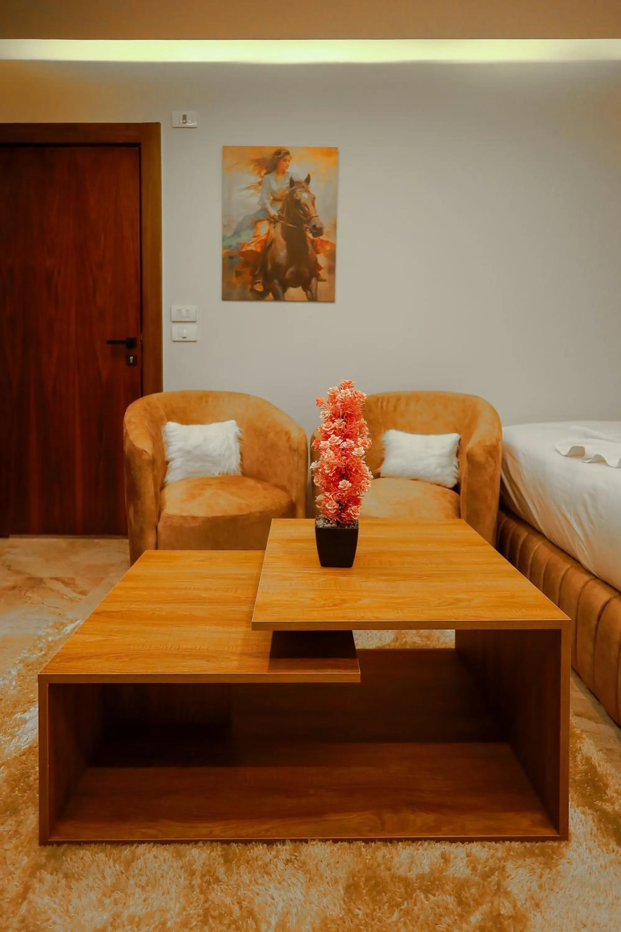 Seating area, Bed in The Muse Pyramids INN