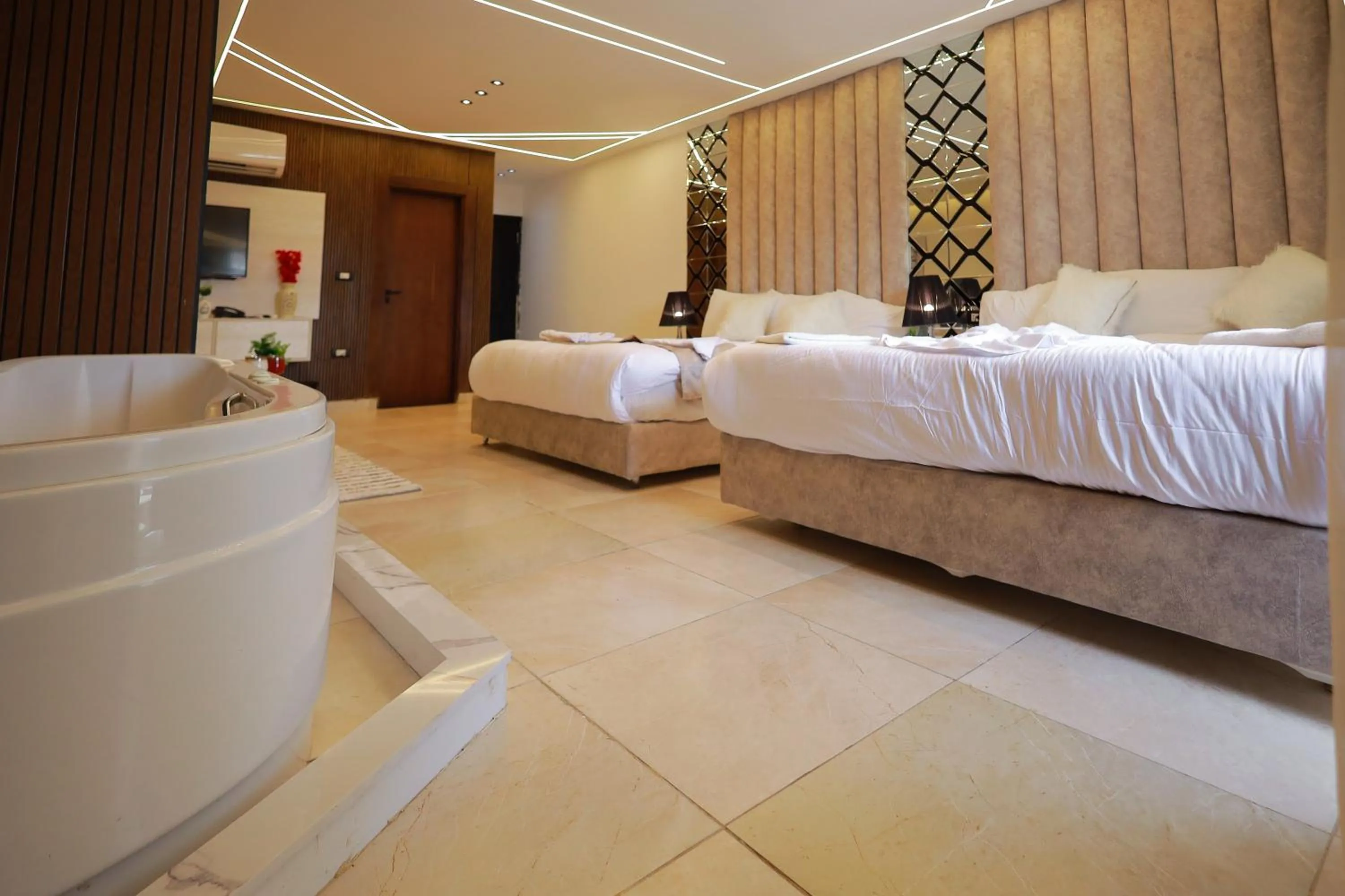 Bed in The Muse Pyramids INN