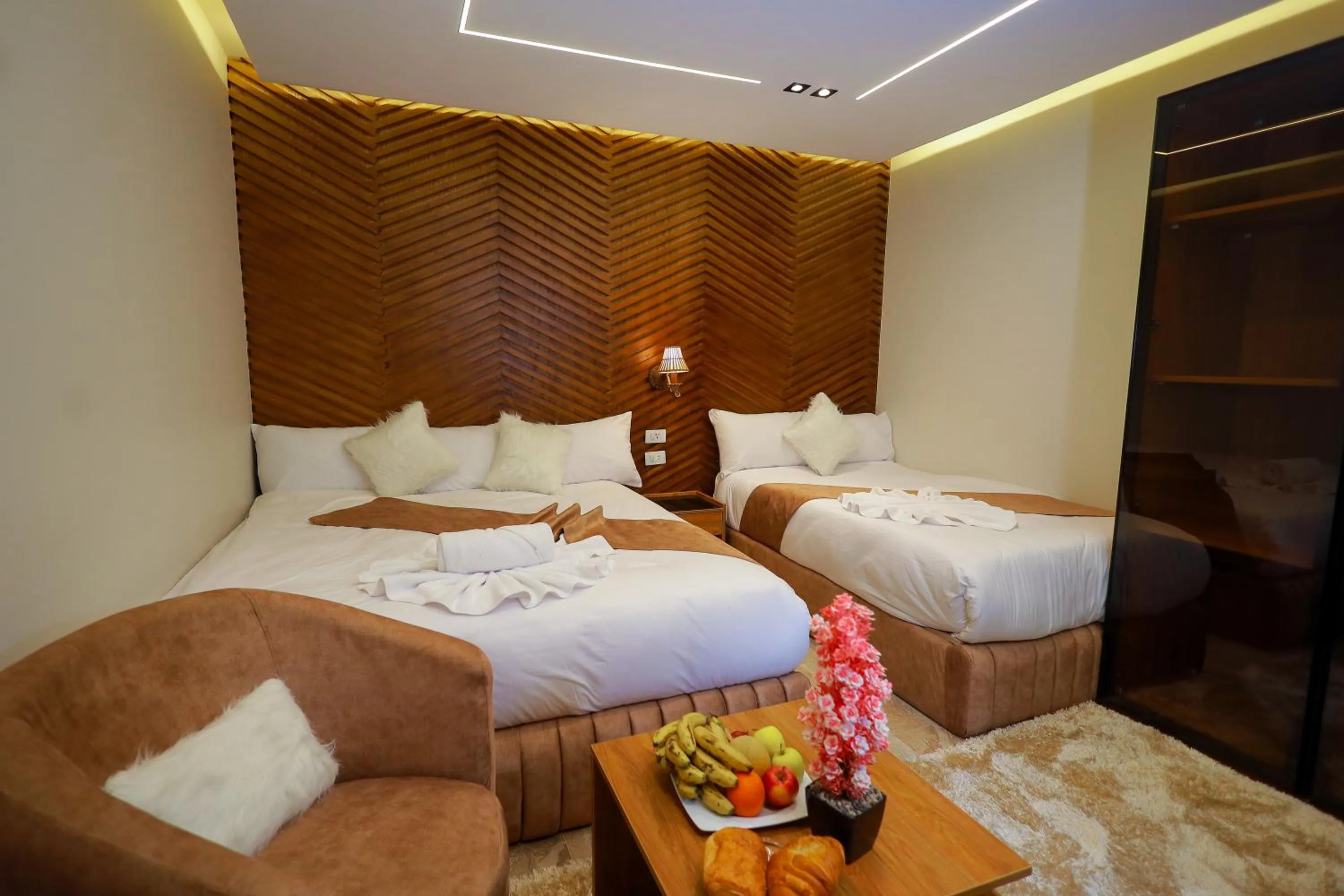 Bed in The Muse Pyramids INN