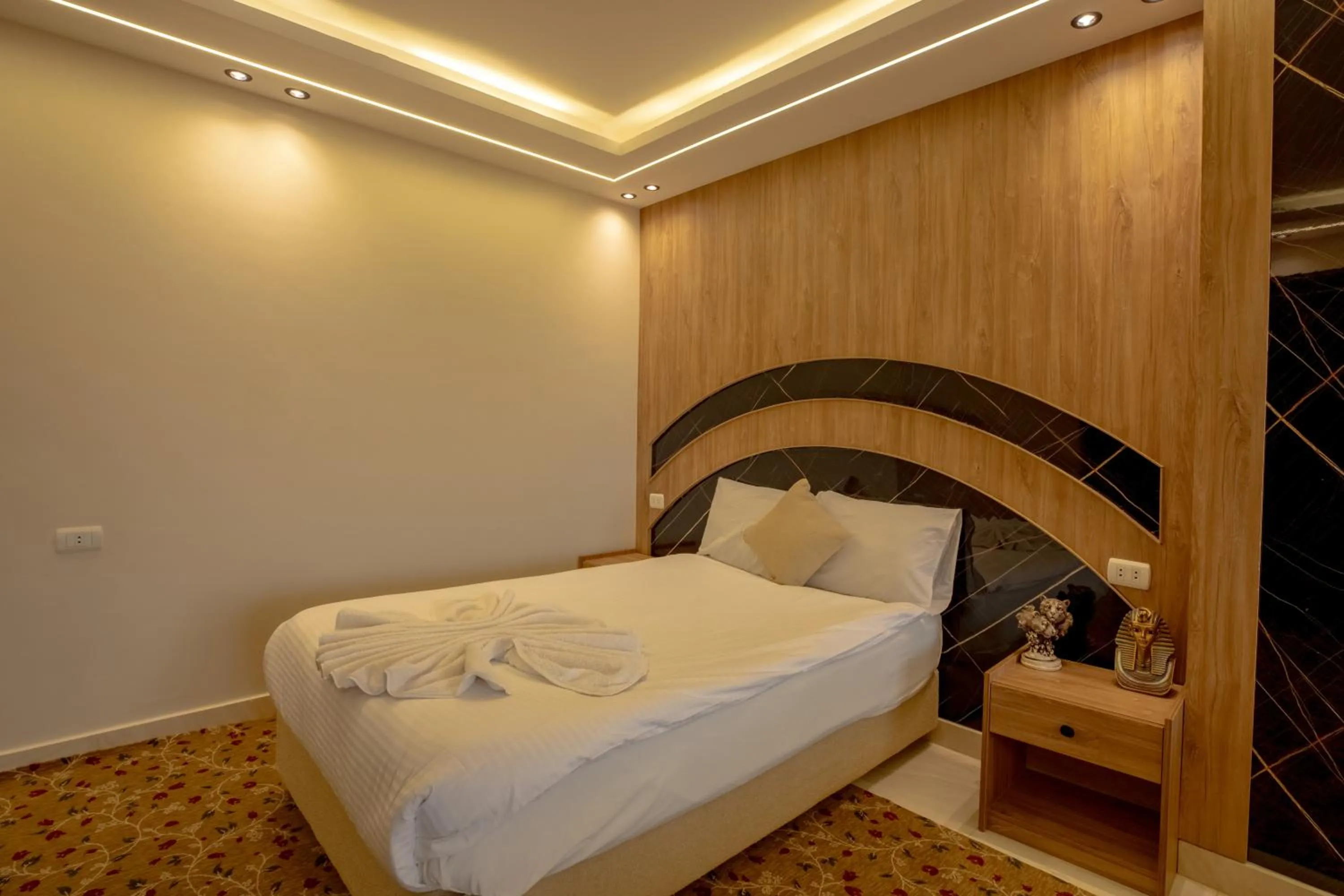 Bed in The Muse Pyramids INN