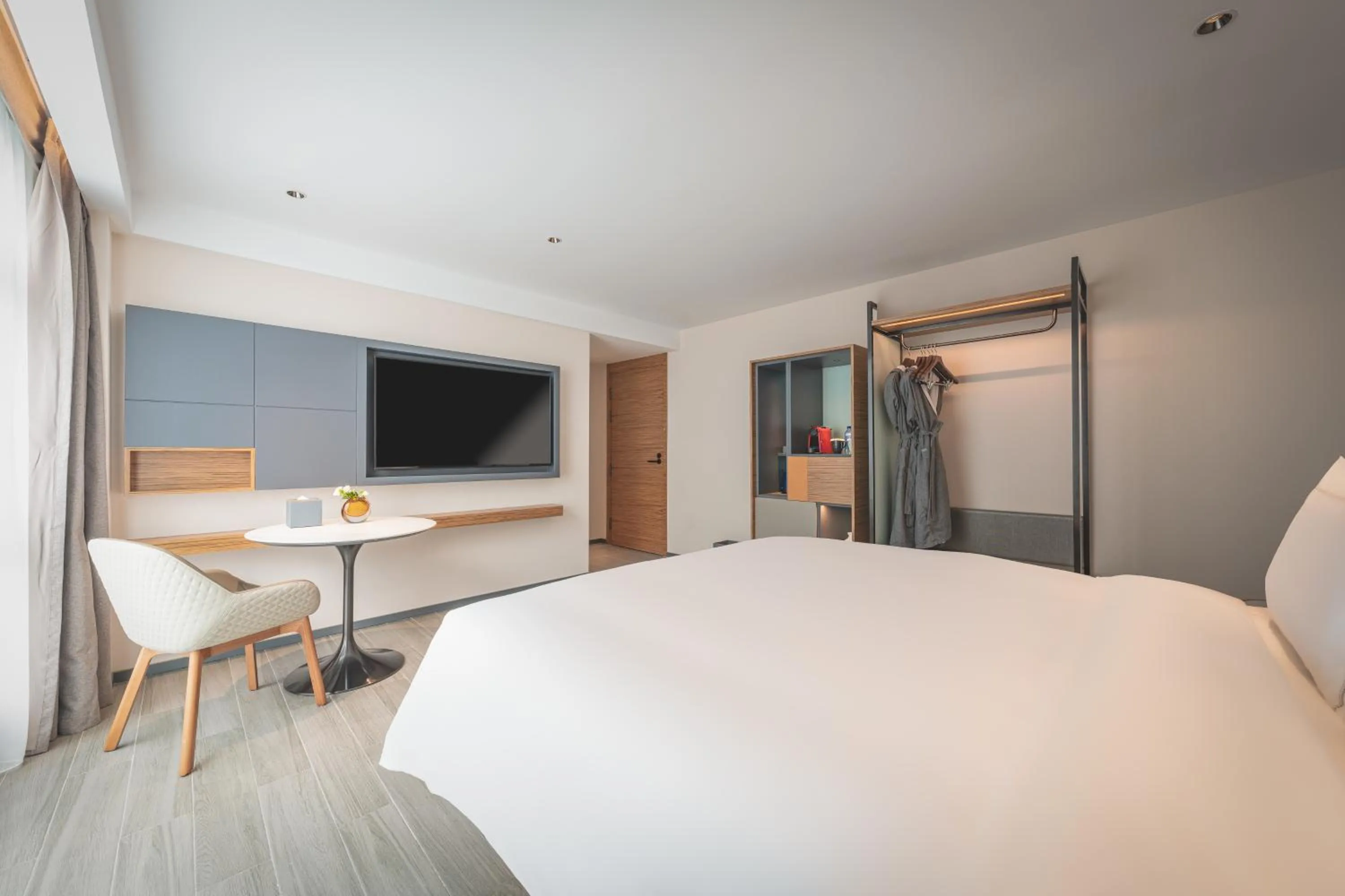 Communal lounge/ TV room in UrCove by HYATT Nanjing Downtown