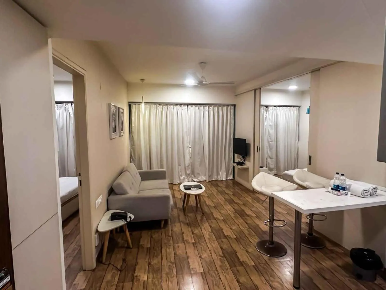 Living room, Bed in Ambition studio apartment at rajhans belliza