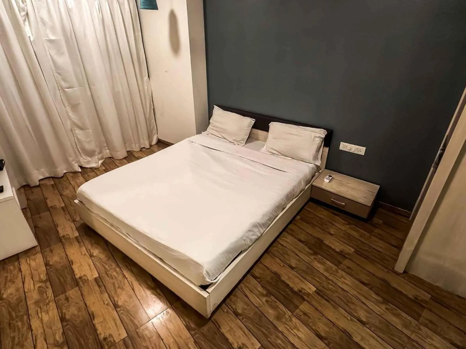 Bed in Ambition studio apartment at rajhans belliza