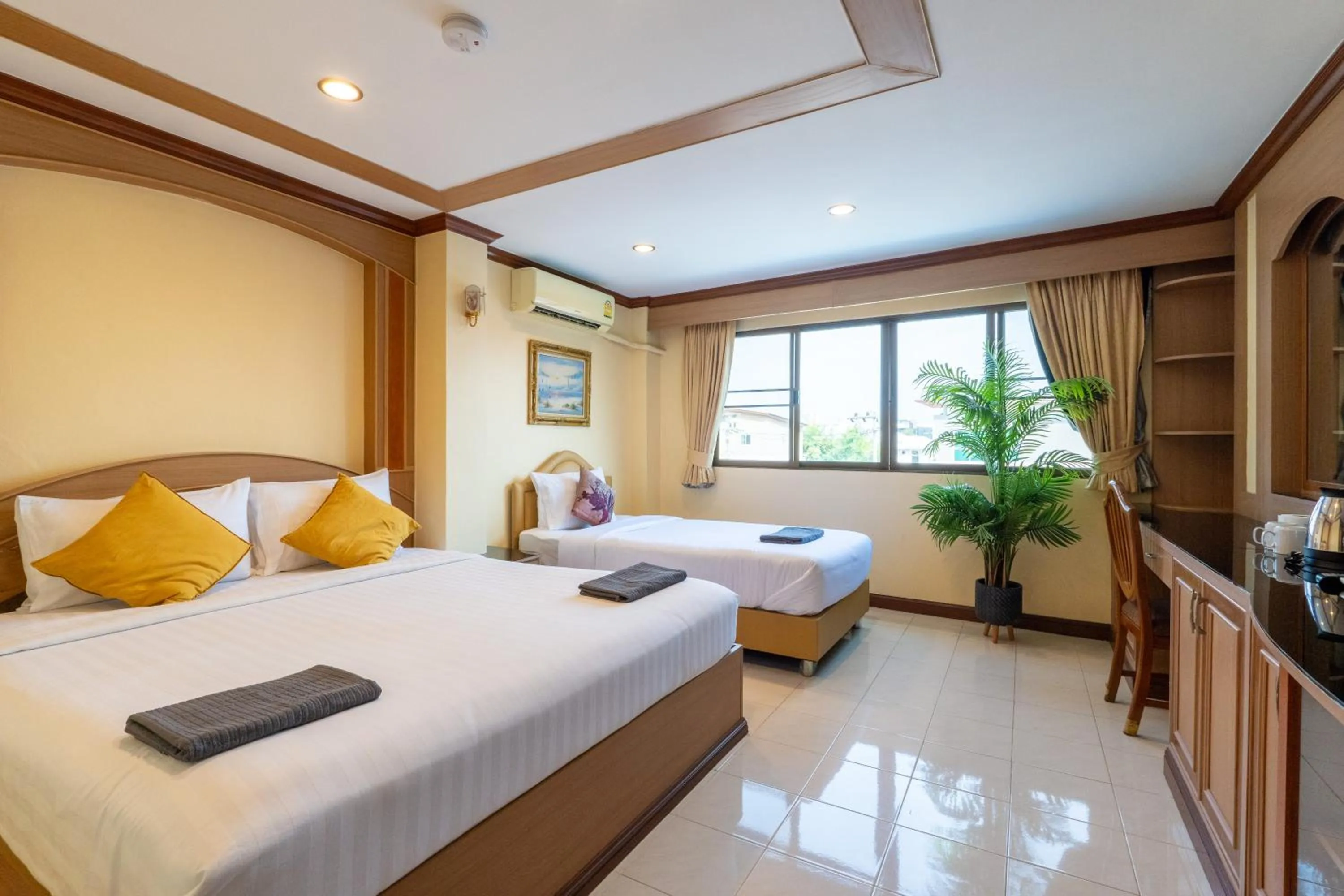 Bed in La Casa South Pattaya Hotel