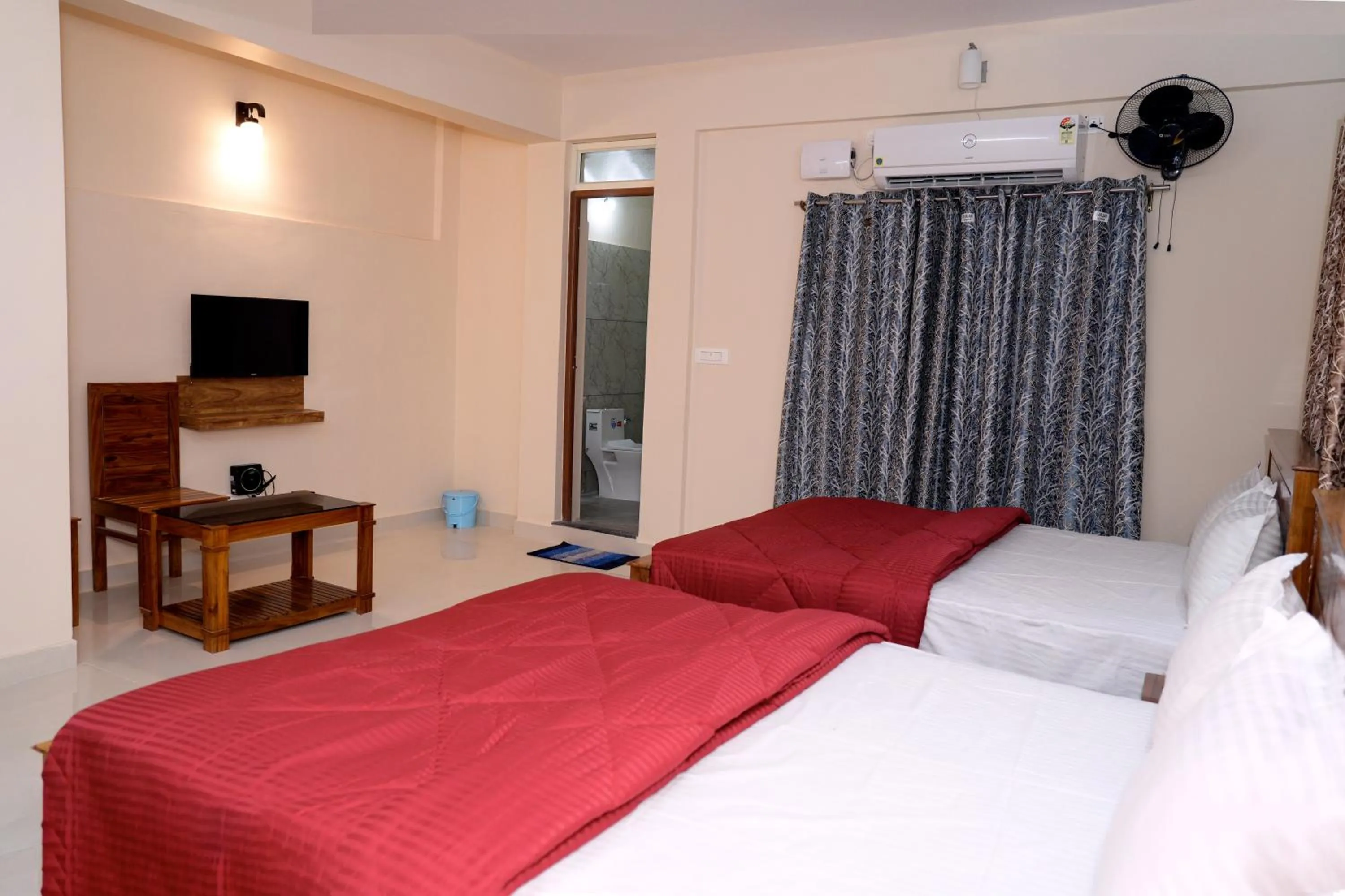 Communal lounge/ TV room, Bed in HILL PALACE RESIDENCY COORG