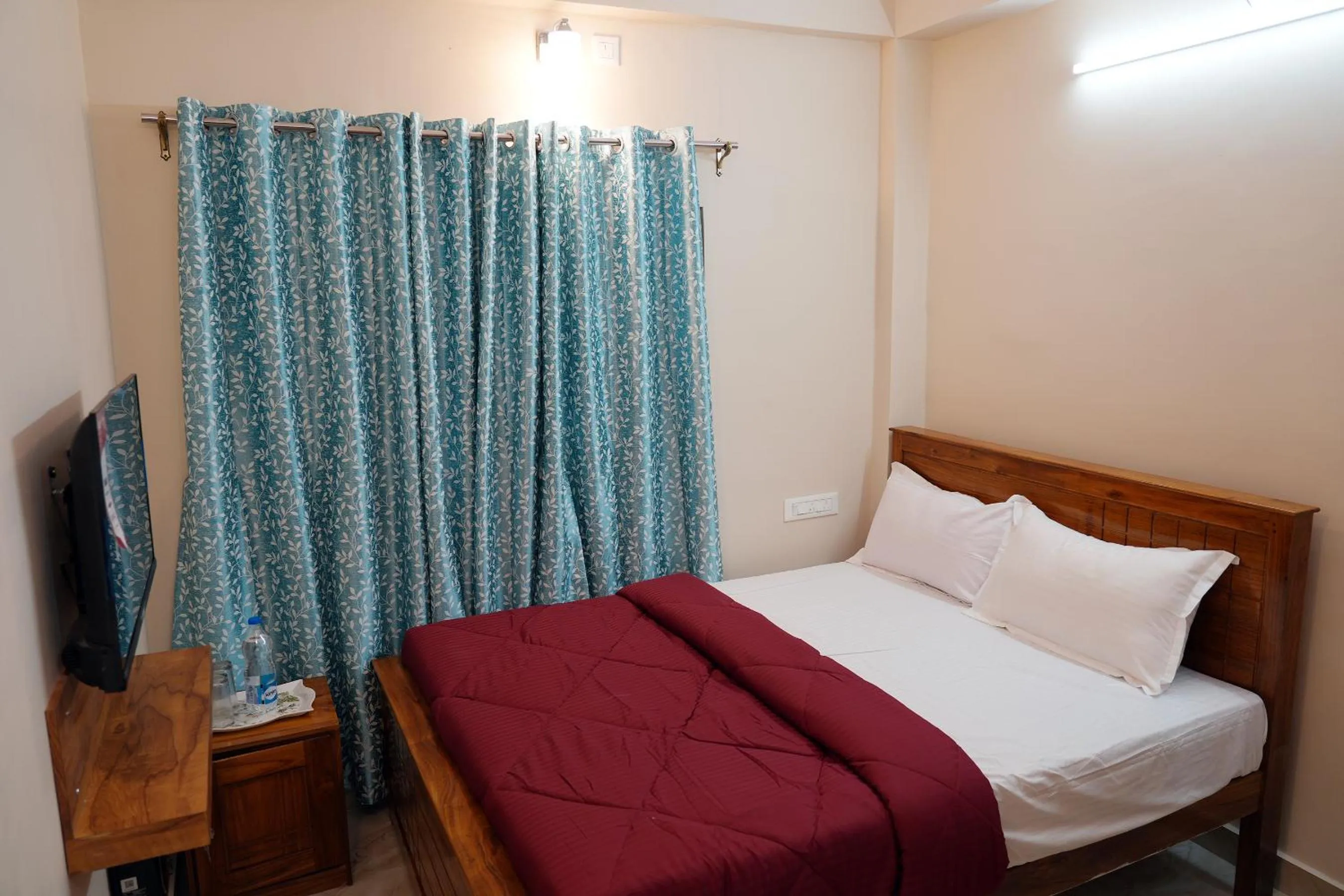 Bed in HILL PALACE RESIDENCY COORG