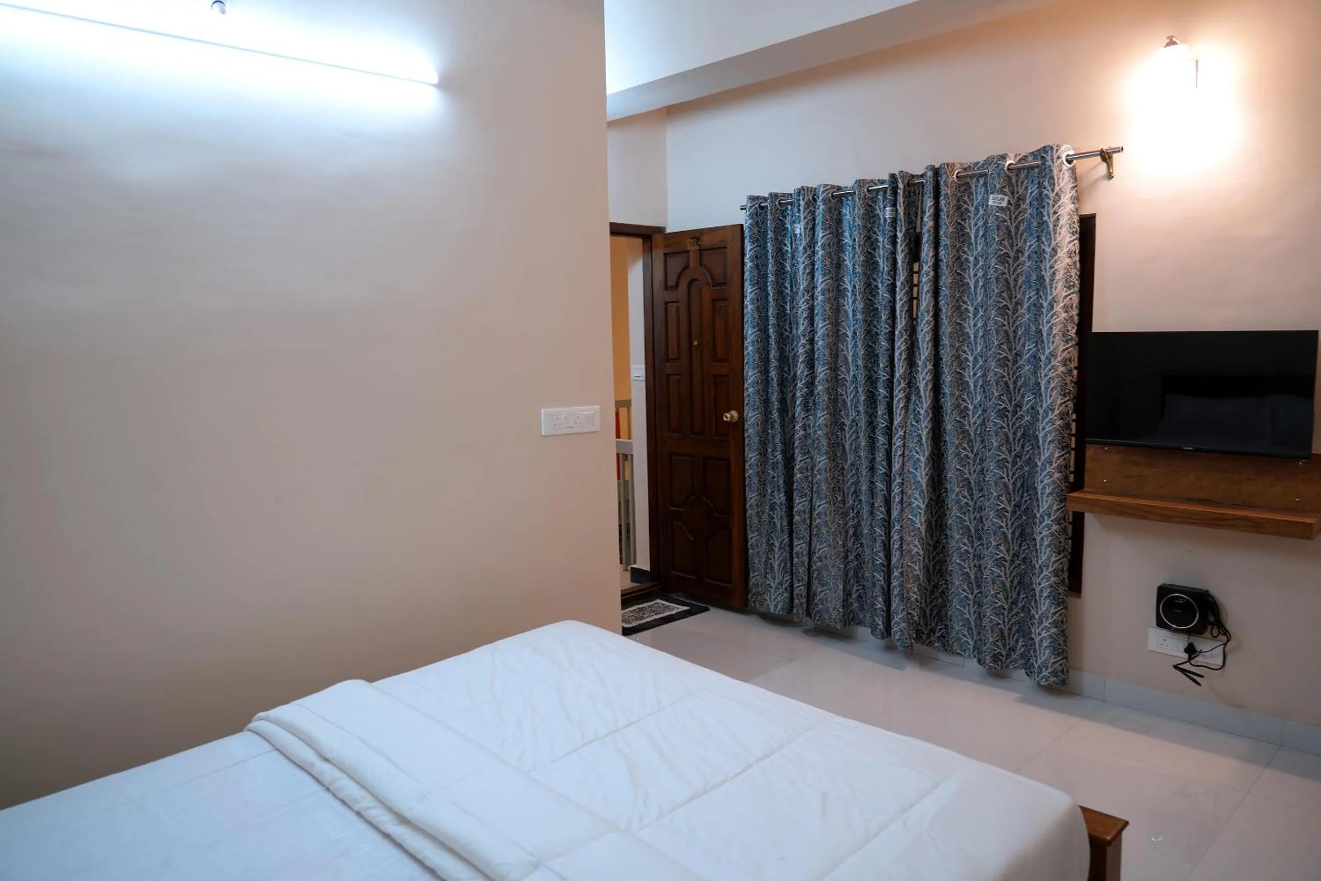 Bed in HILL PALACE RESIDENCY COORG